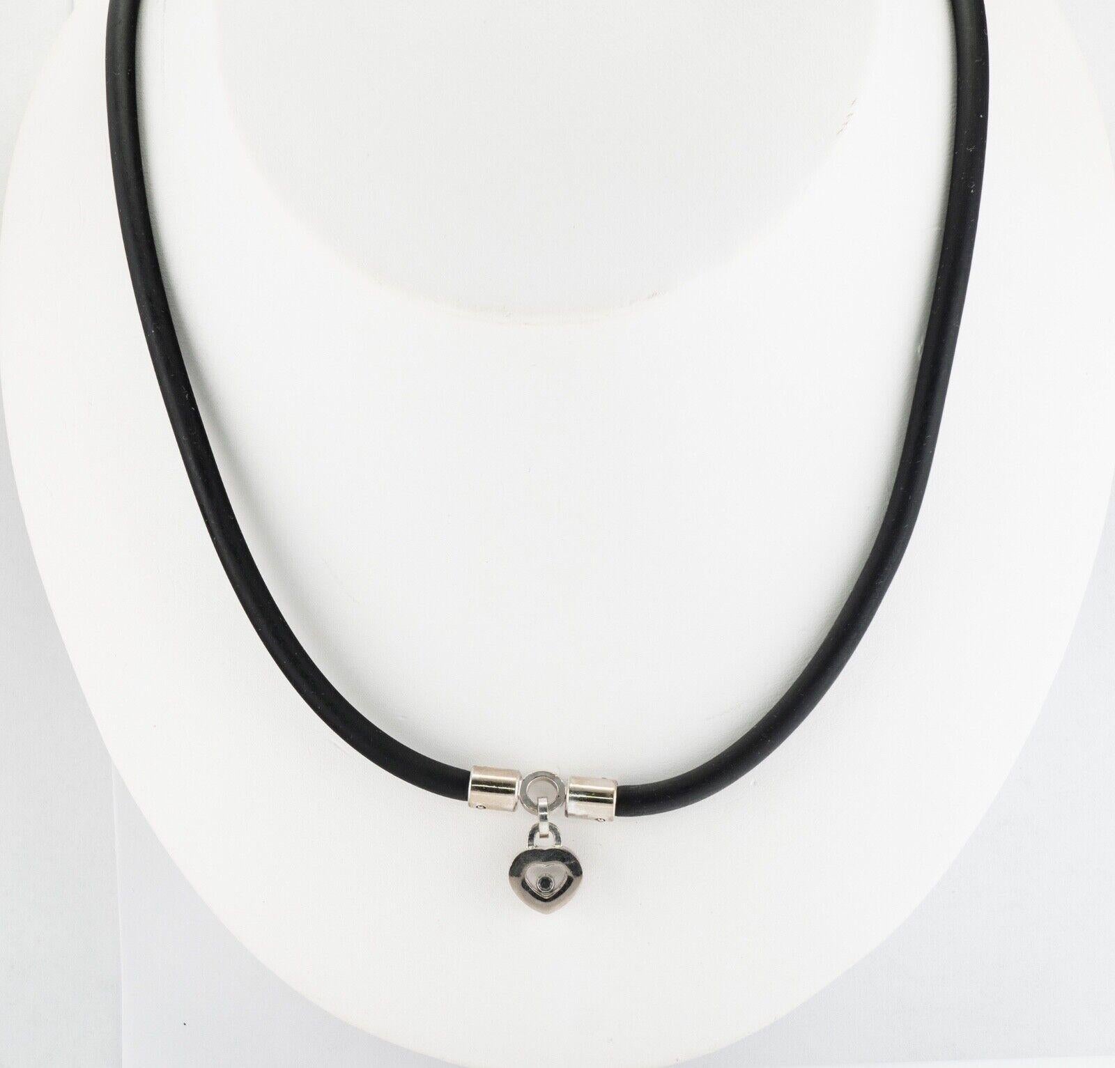 Chopard Black Diamond Heart Necklace Charm 18K White Gold Rubber Cord

This playful necklace from Chopard's Happy Diamonds collection has a vibrancy that is incomparable. The necklace is a black rubber cord with petite white gold pendant. The