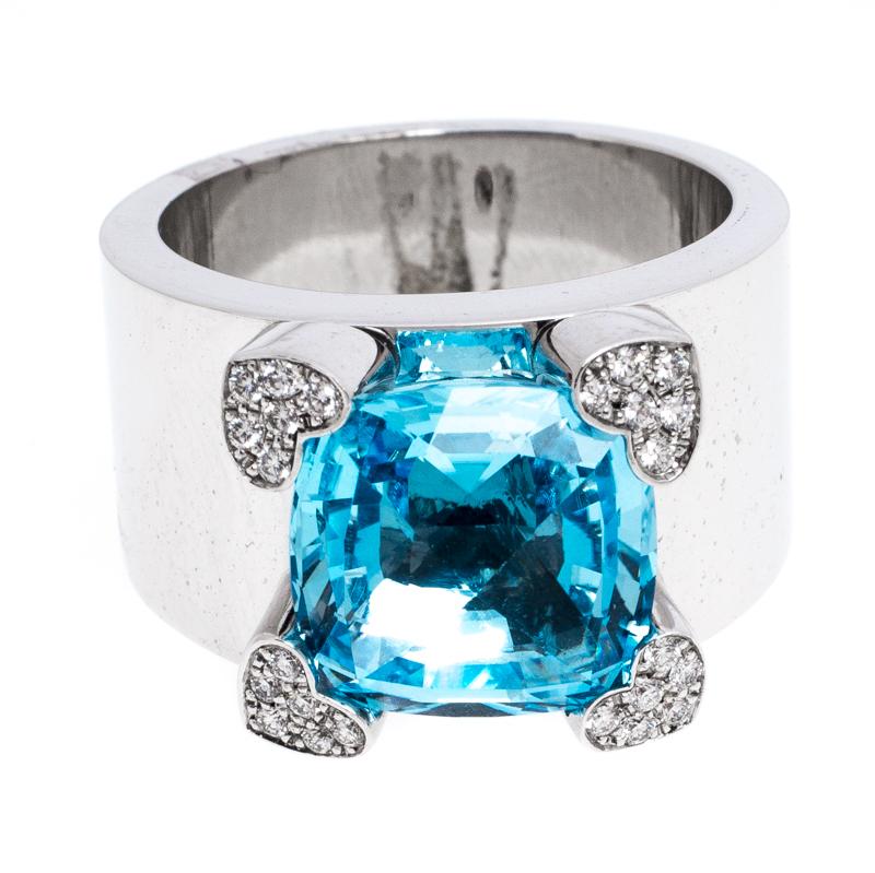 This incredible ring from Chopard has been created by Maison's skilled craftsmen with such precision that every line and curve is smoothened to perfection. On the 18k white-gold band sits a topaz gemstone and it is skillfully surrounded by four
