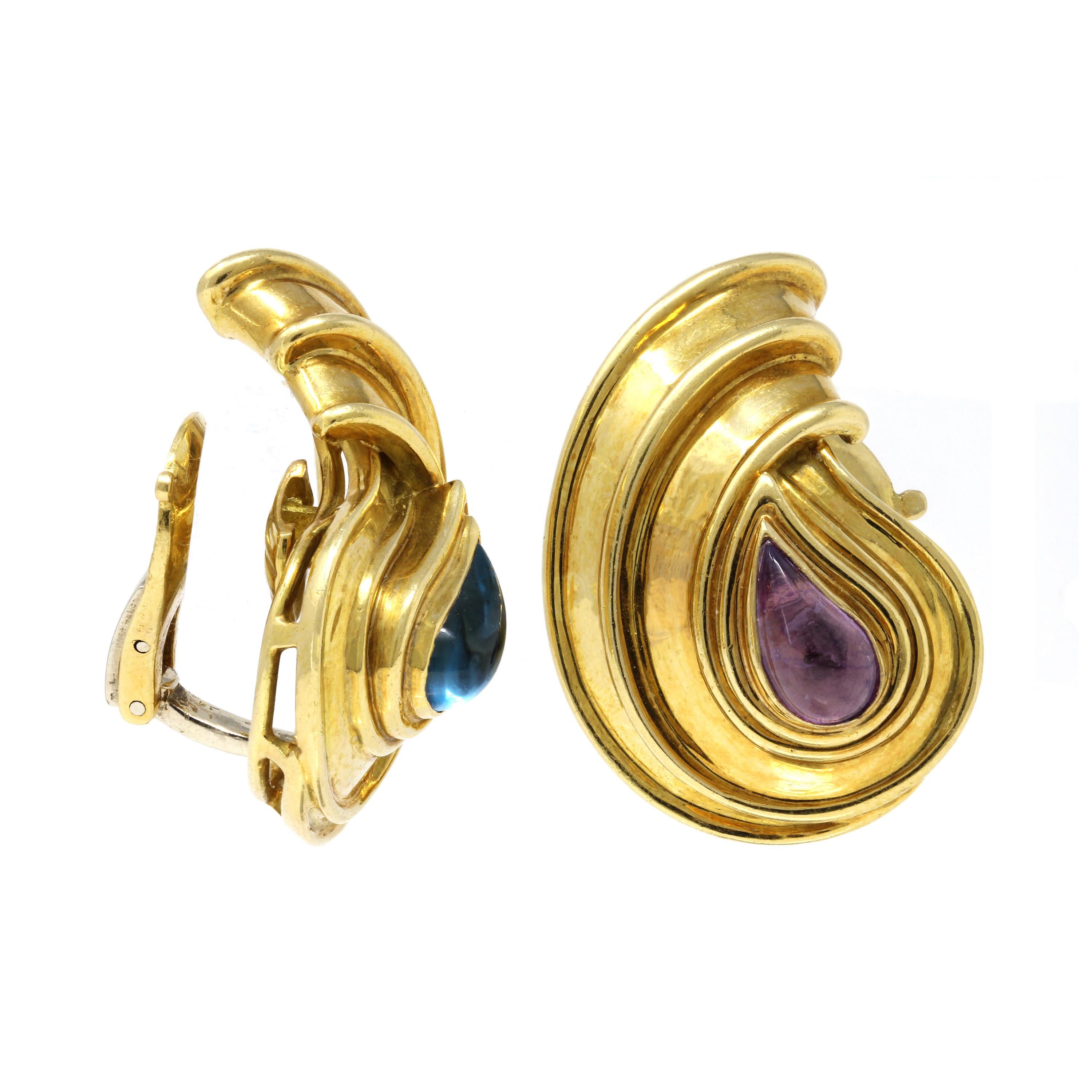 A signed Chopard missmatched gemstones clip on earrings from the early Casimir collection circa 1990. designed as  a paisley motif. One earring features a polished aquamarine while the other has an amethyst. Both gemstones are cut to follow the