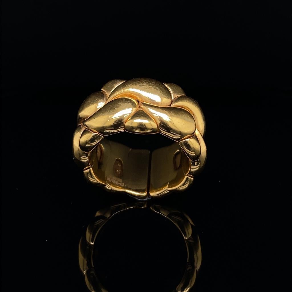 A Chopard 'Casmir' 18 karat yellow gold ring, circa 1990.

Crafted in 18 karat yellow gold, formed of two rows of stylised paisley design links with a smooth polished finish.

This ring is flexible and therefore can accommodate a range of finger