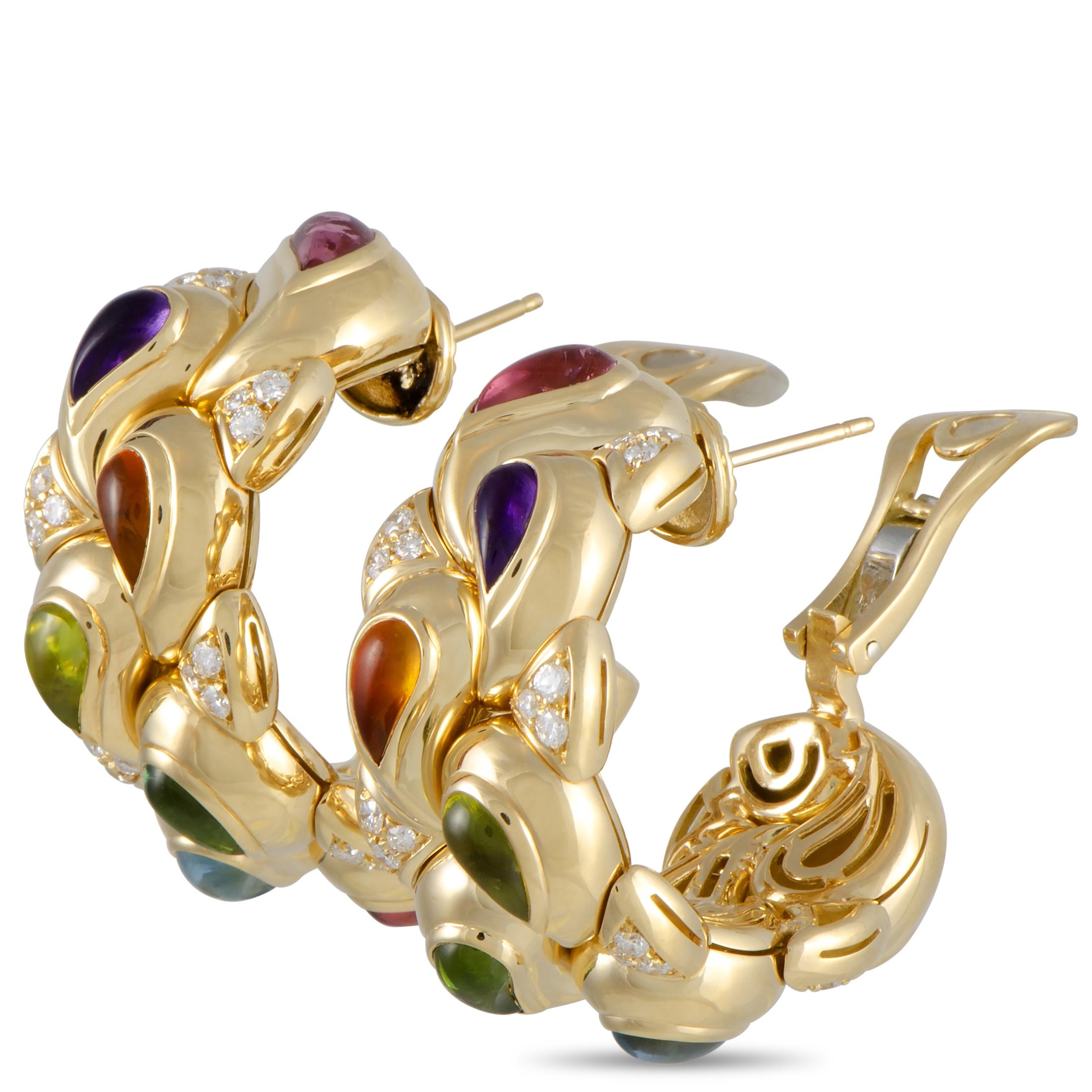 The Chopard “Casmir” earrings are crafted from 18K yellow gold and set with citrine, peridot, tourmaline, amethyst, and topaz stones, and with a total of 1.20 carats of diamonds. The earrings measure 1.50” in length and 0.60” in width and each of
