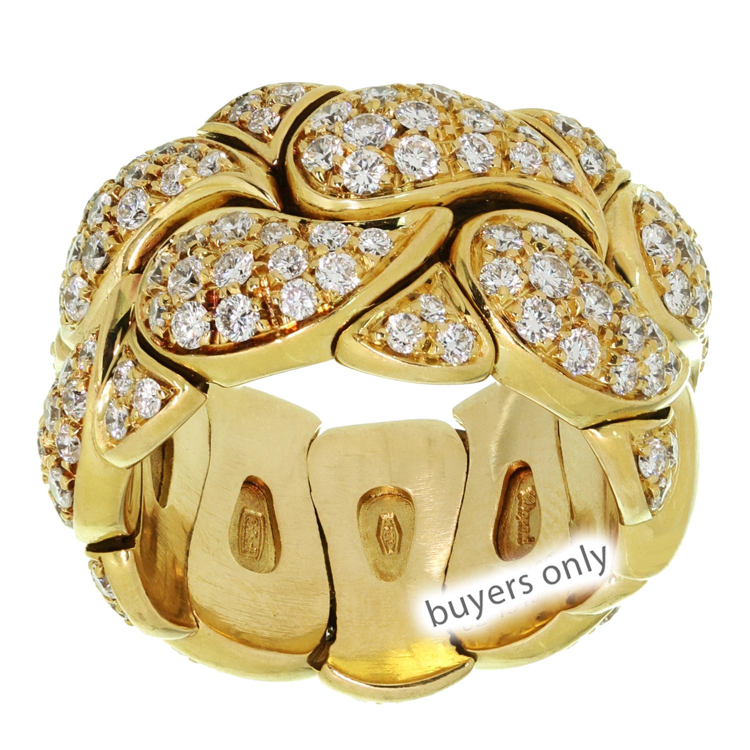 This fabulous Chopard ring from the elegant Casmir collection features a cuff band composed of paisley motifs crafted in 18k yellow gold and set with brilliant-cut round F-G VVS2-VS1 diamonds. Made in Switzerland circa 1990s. Measurements: 0.51