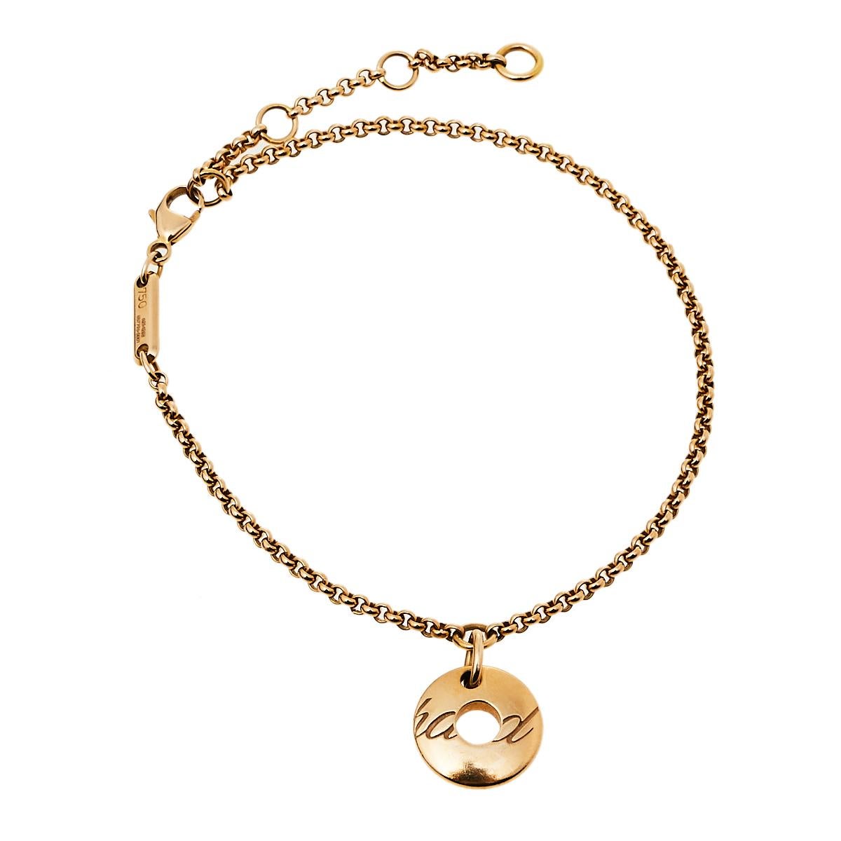 Artfully made, this flawless bracelet by Chopard can be your next prized possession. True to Chopard's spirit of perfection, this piece was sculpted using 18k rose gold. The bracelet features a circular charm that has signature engravings and three