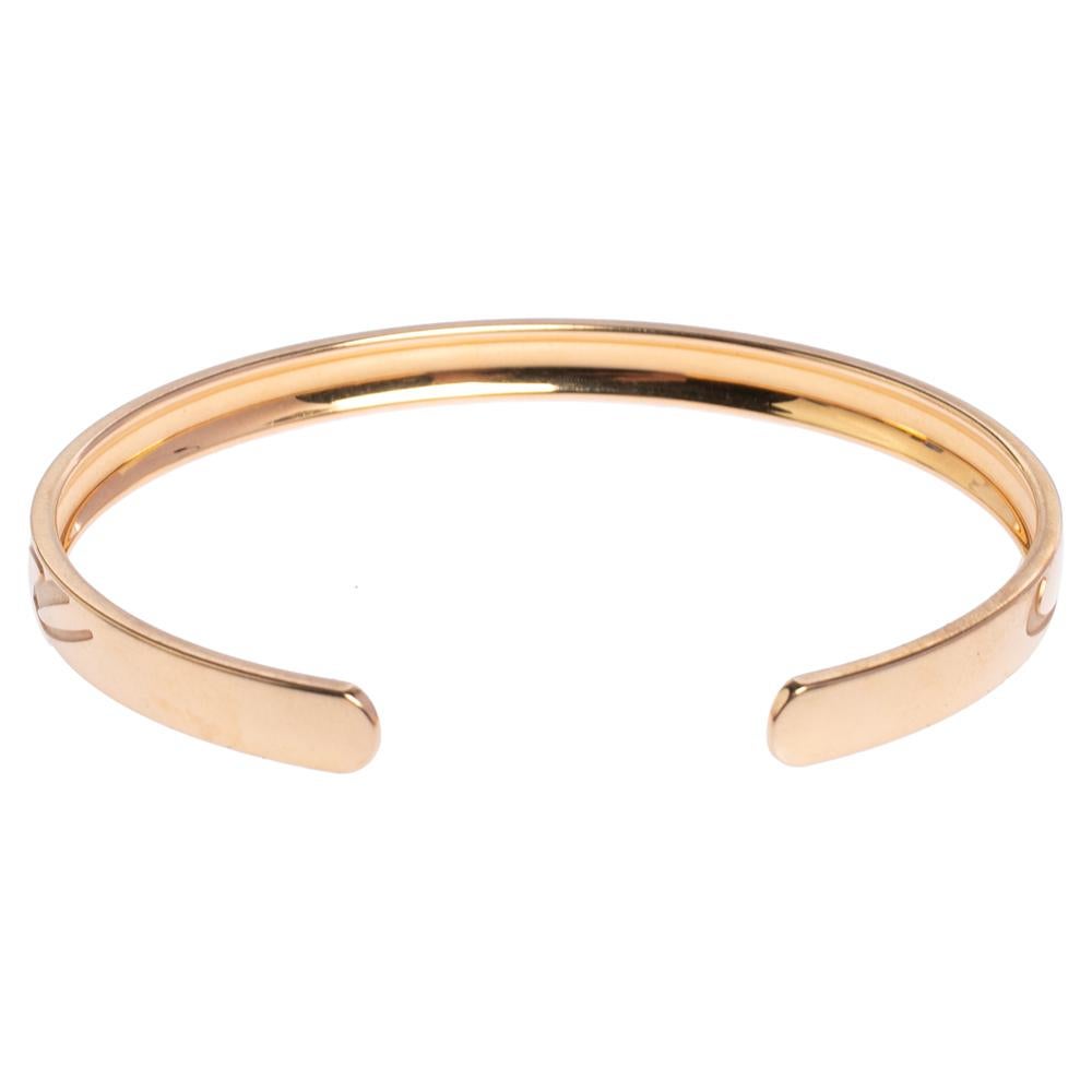 This creation from Chopard speaks luxury in a way that is minimal and elegant. The bracelet has been excellently crafted from 18k rose gold in an open cuff style. Set beautifully on the bracelet are cursive engravings of the brand's name—a signature