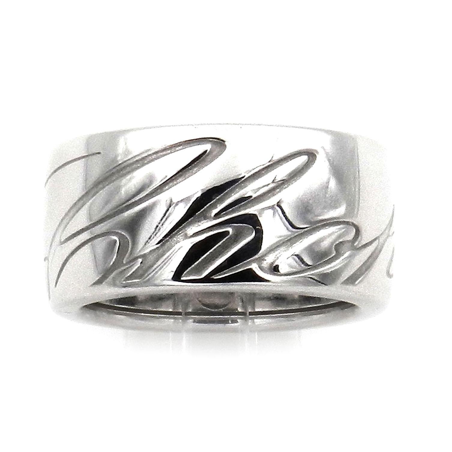 Chopard Chopardissimo 18K White Gold Ring Signature Band Ring 
 
Authentic Chopard  band ring made of 18 karat white gold from the Chopardissimo collection. The wide, luxurious band ring with the surrounding Chopard logo in a timeless design is made
