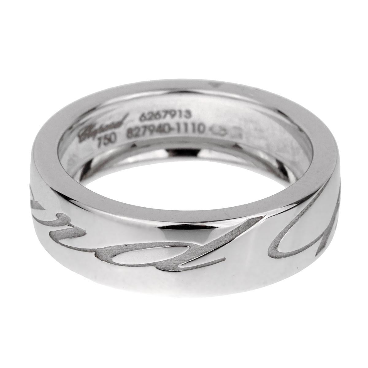 A chic Chopard band ring engraved with the iconic Chopard logo throughout in 18k white gold. The ring measures a size 6