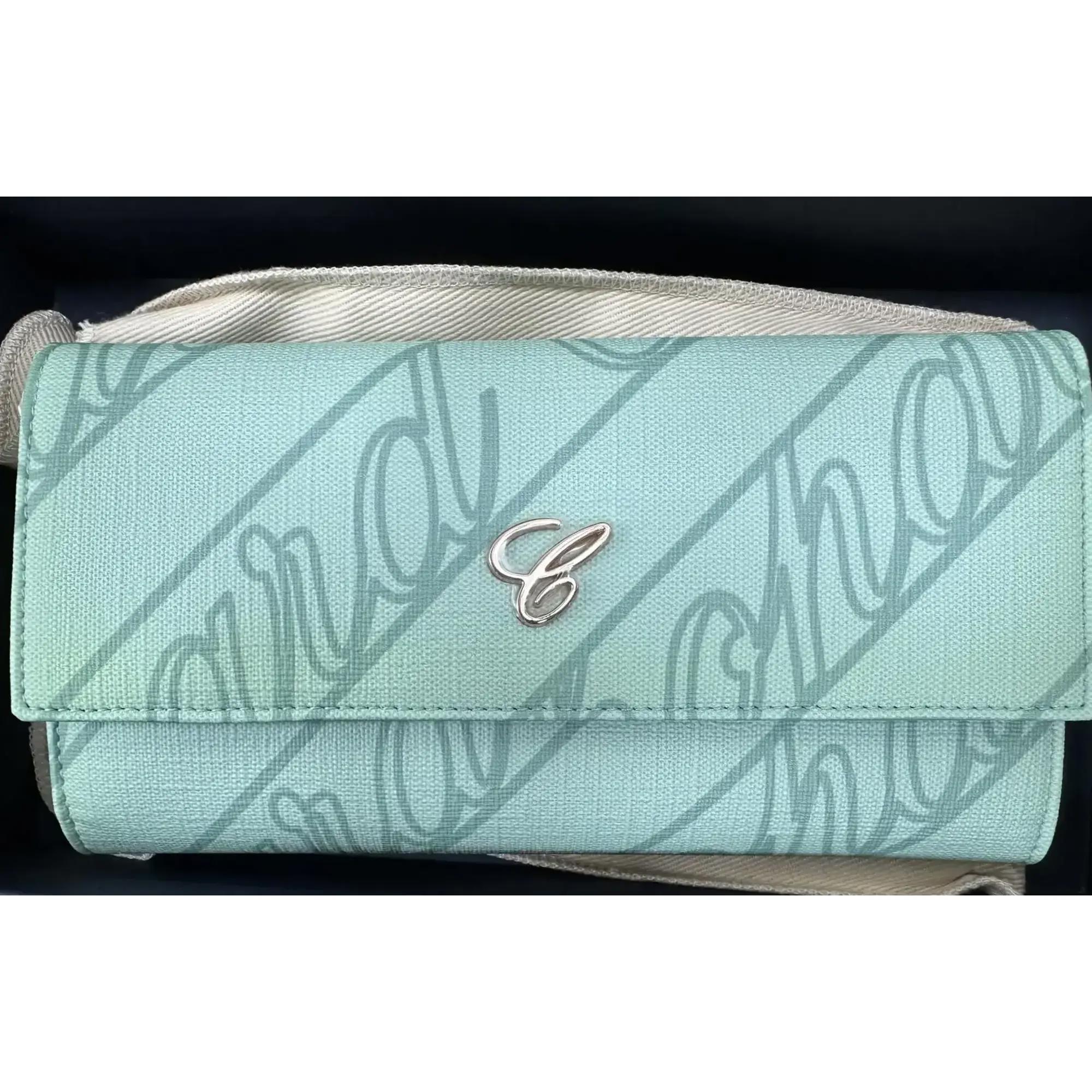 Chopard Classic Continental ladies wallet crafted in mint green canvas with logo print and embellished with Chopard 