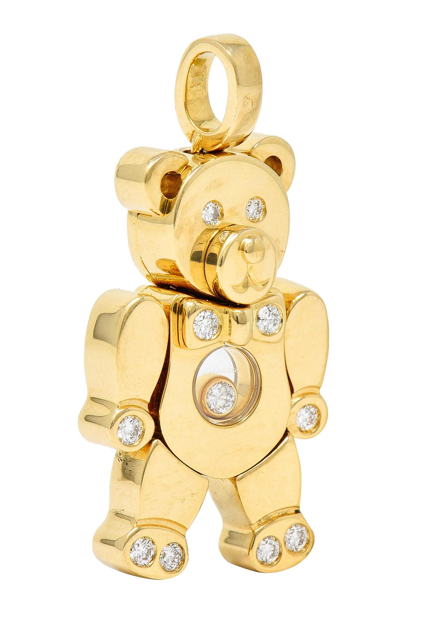 Pendant is a teddy bear design - stylized and with a bow tie

Limbs slightly articulate and are accented by flush set round brilliant cut diamonds

Body's center is glass covered and features a floating bezel set diamond

Total diamond weight is