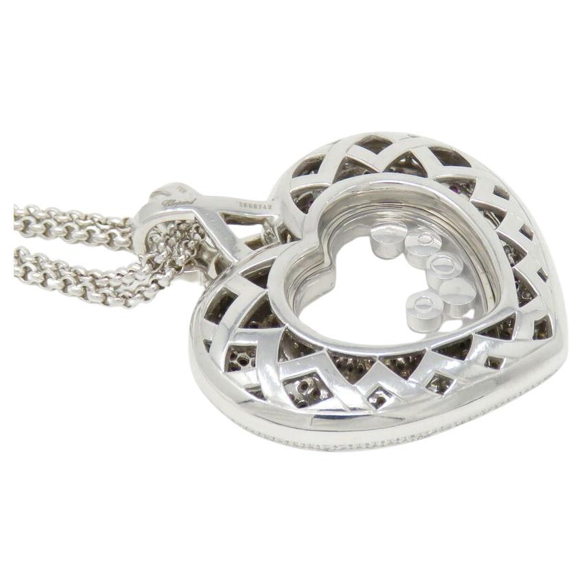 Introducing an exquisite Chopard necklace, meticulously crafted from 18K white gold
Diamonds tested and are natural, approx 2.8ct TW, most about F-G and VS range

Necklace 16 inches long and 11mm wide. Pendant 26 x 22mm

Marked: Chopard 81/5427-20