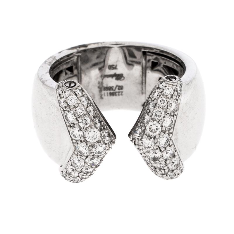 Beautiful and feminine, this ethereal ring is a statement piece that is designed to complement a variety of your ensembles. This gorgeous piece is rendered in 18K white gold featuring a band silhouette with an open top. The ring exhibits a beautiful