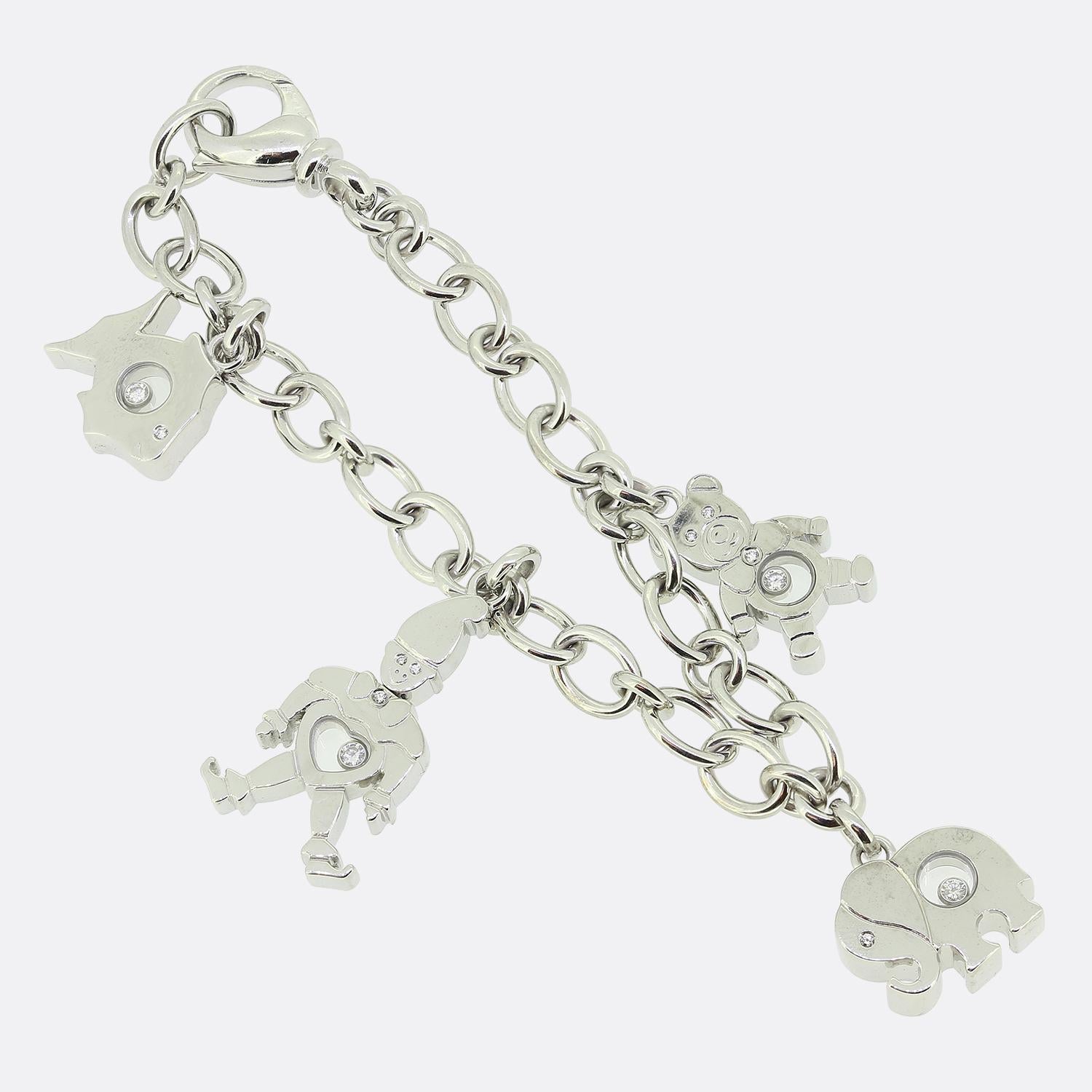 This is a wonderful charm bracelet from the world renowned luxury jewellery designer, Chopard. Crafted in 18ct white gold, this belcher style link bracelet features four large charms; A fish, a teddy bear, an elephant and a clown. Each of the charms