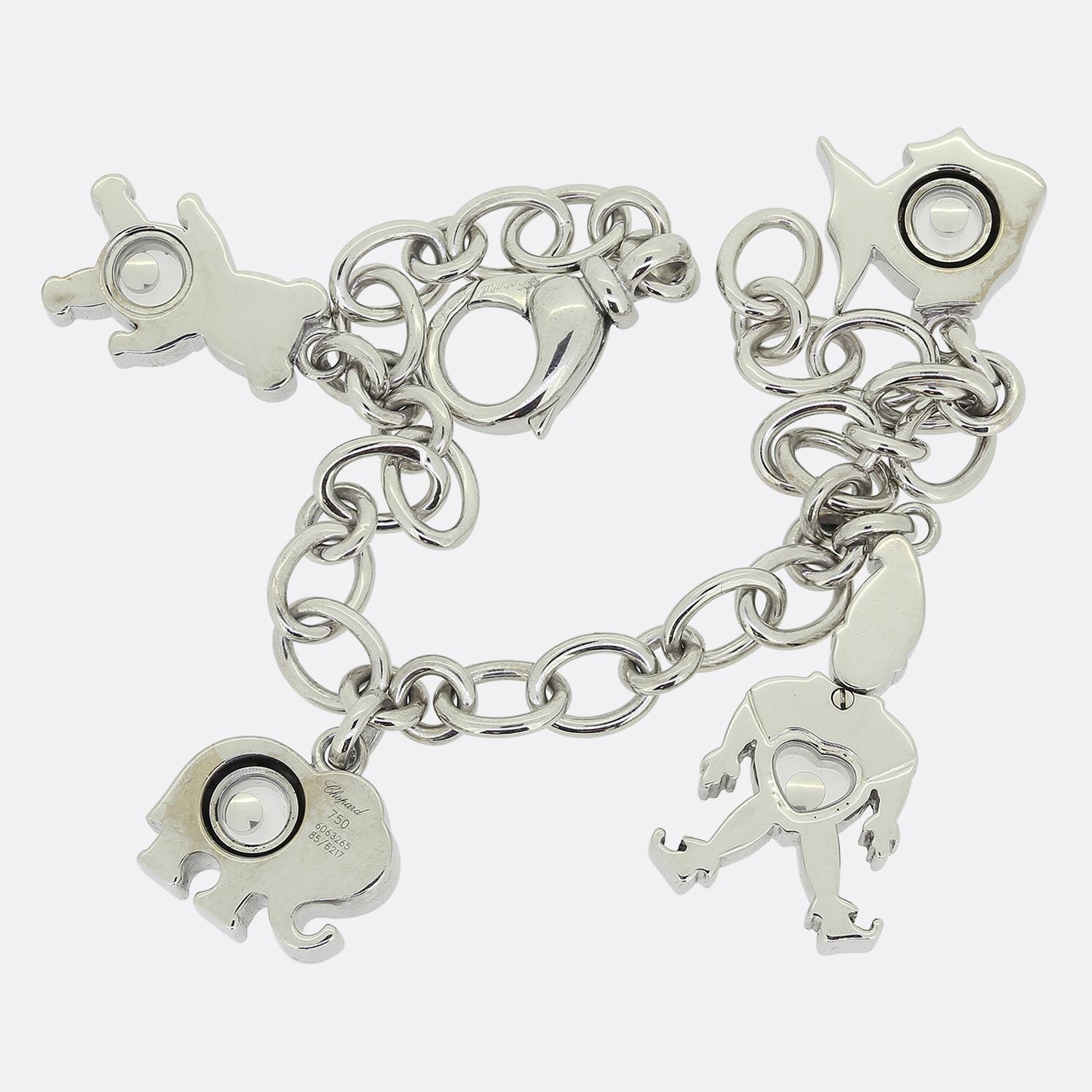 This is a wonderful charm bracelet from the world renowned luxury jewellery designer, Chopard. Crafted in 18ct white gold, this belcher style link bracelet features four large charms; A fish, a teddy bear, an elephant and a clown. Each of the charms