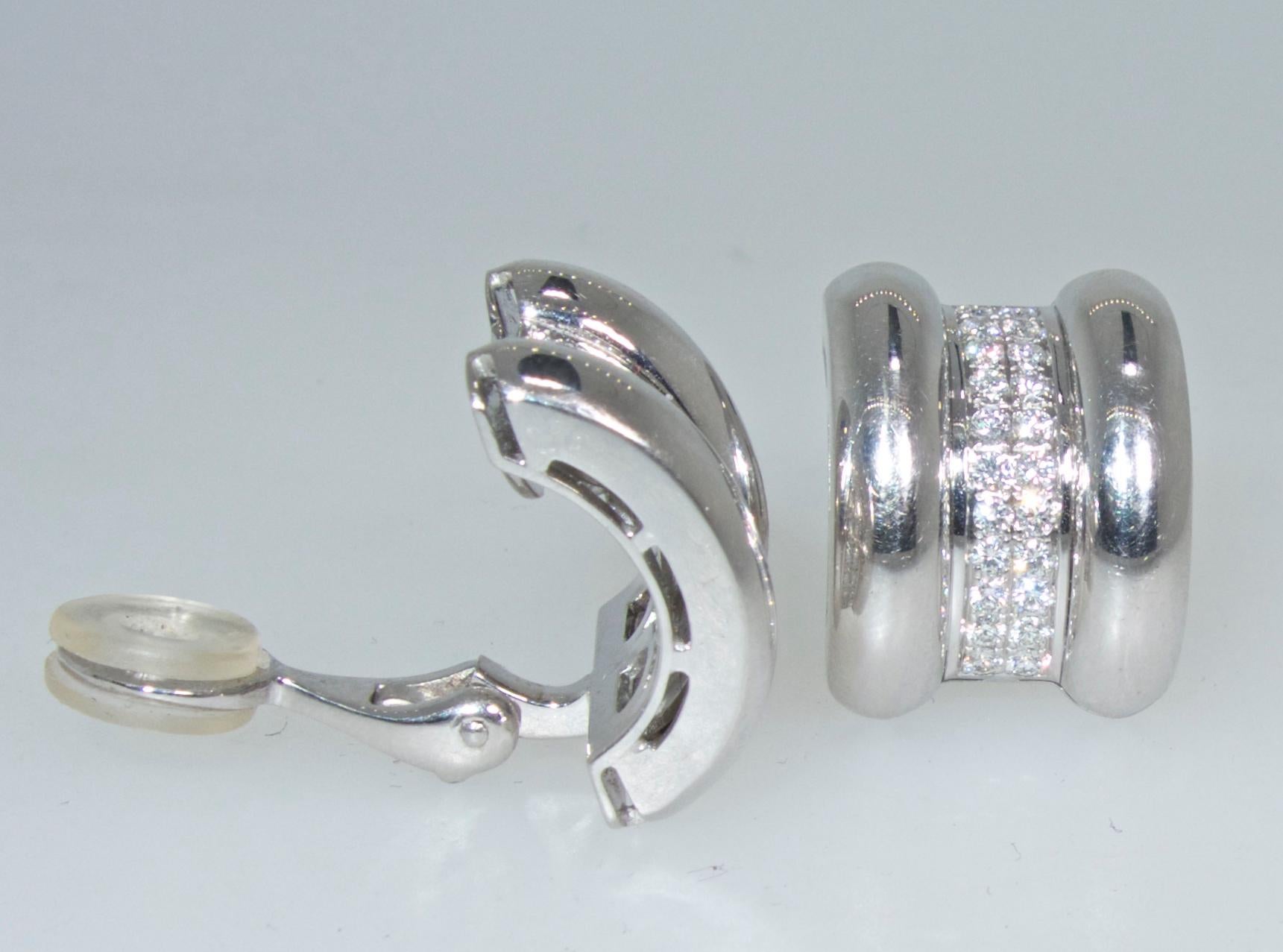 18K white gold with fine white diamonds.   There are 44 well cut, well matched fine round brilliant cut diamonds weighing approximately 1. ct.  These earrings made by the world famous jewelry and watch house, Chopard are in new like condition and