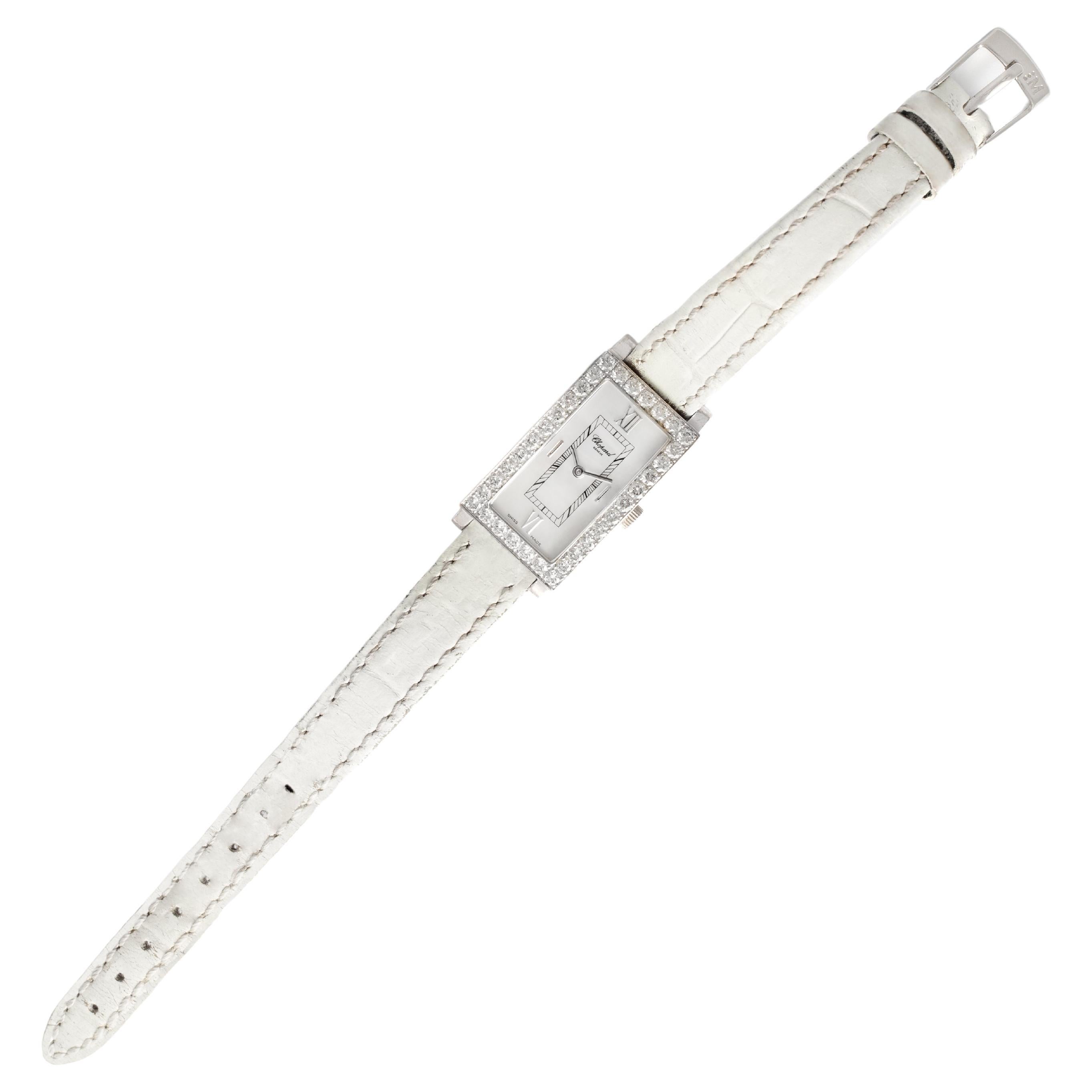 Chopard Diamond 18K white gold wristwatch. 
Mother-of-pearl Rectangle dial.
Signed Chopard. Numbered 13/6973-20. 559119, 488 1.
Swiss marks.
Strap is delivered brand new to the new buyer.

This beautiful Chopard Ladies Rectangle Wristwatch in 18