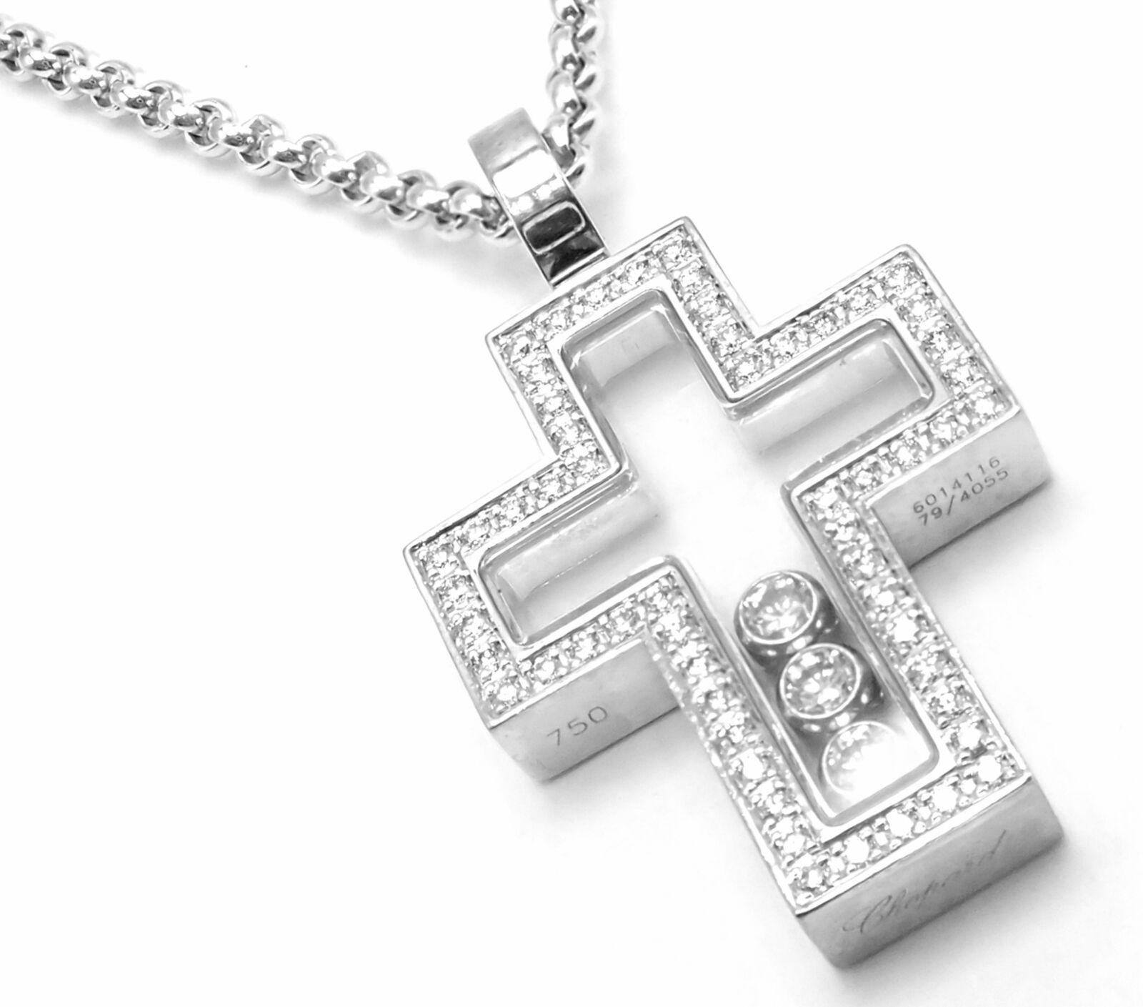 18k Yellow Gold Diamond Happy Diamonds Cross Pendant Necklace by Chopard.  
With Round Brilliant Diamonds = VS1 clarity, G color total weight approximately .38ct
Details:  
Length: 20