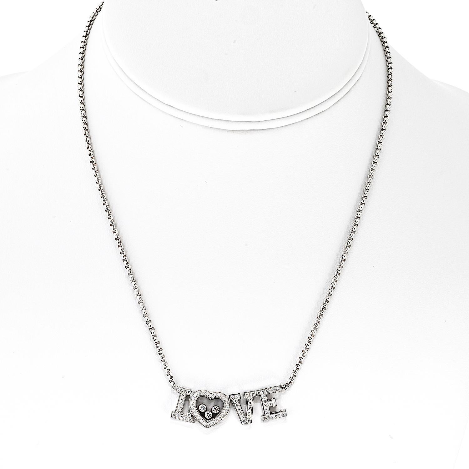 This elegant Chopard Happy Diamonds necklace features a heart-shaped pendant crafted in 18K white gold, measuring 25mm across. At its center are five signature floating diamonds, totaling approximately 1.30 carats, dancing freely between sapphire