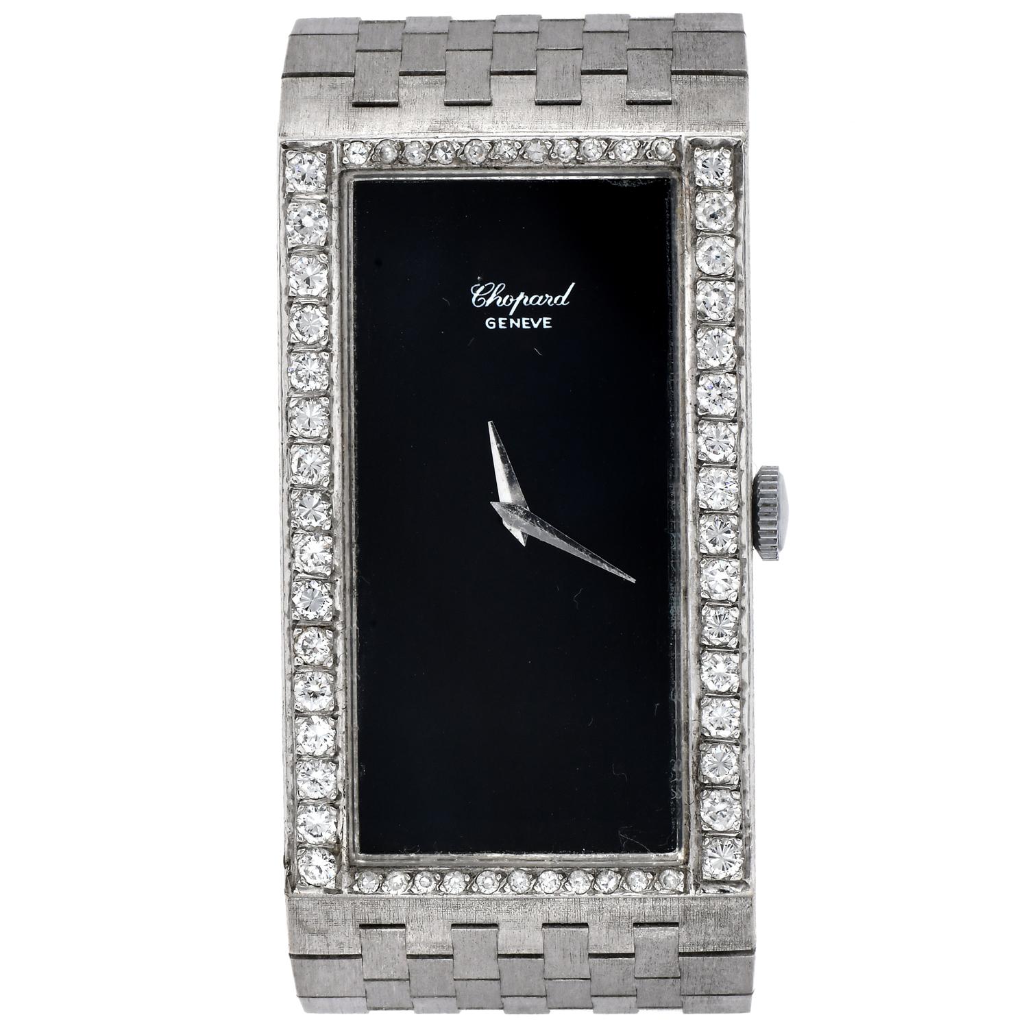 An exquisite Vintage large Chopard Diamond and onyx 18K White Gold Rectangular  Winding Ladies' Watch.

Completely crafted in 18K White Gold, weighing approximately 66.3 grams.

Features a halo of dazzling Genuine round Diamonds, 54 in total,