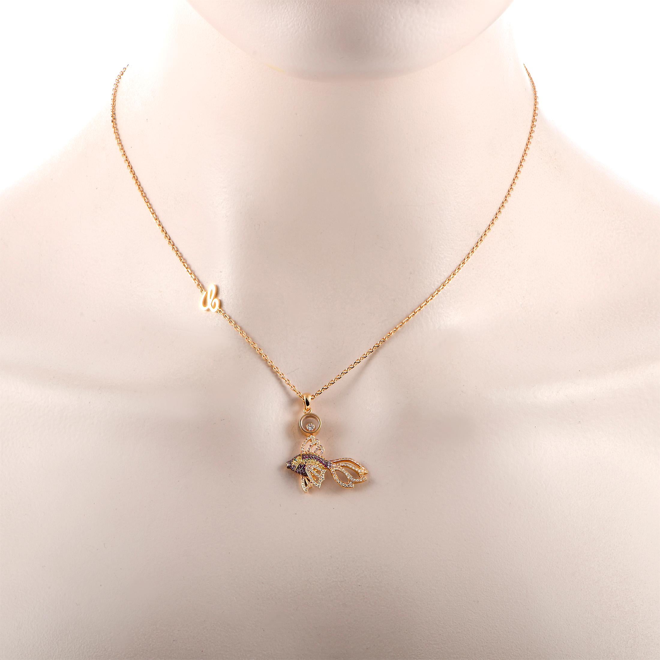 This Chopard necklace is made of 18K rose gold and presented with a 16” chain, onto which a fish pendant is attached that measures 1” in length and 1” in width. The necklace weighs 8.3 grams. It is embellished with a 0.05 ct floating white diamond,