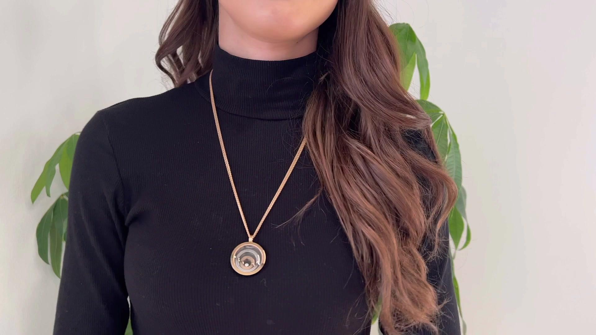 One Chopard Diamond Swiss 18K Tri Color Gold Happy Spirit Floating Circle 24 Inch Necklace. Featuring one round brilliant cut diamond weighing approximately 0.10 carat, graded D-E color, VVS clarity. Crafted in 18 karat yellow, rose, and white gold