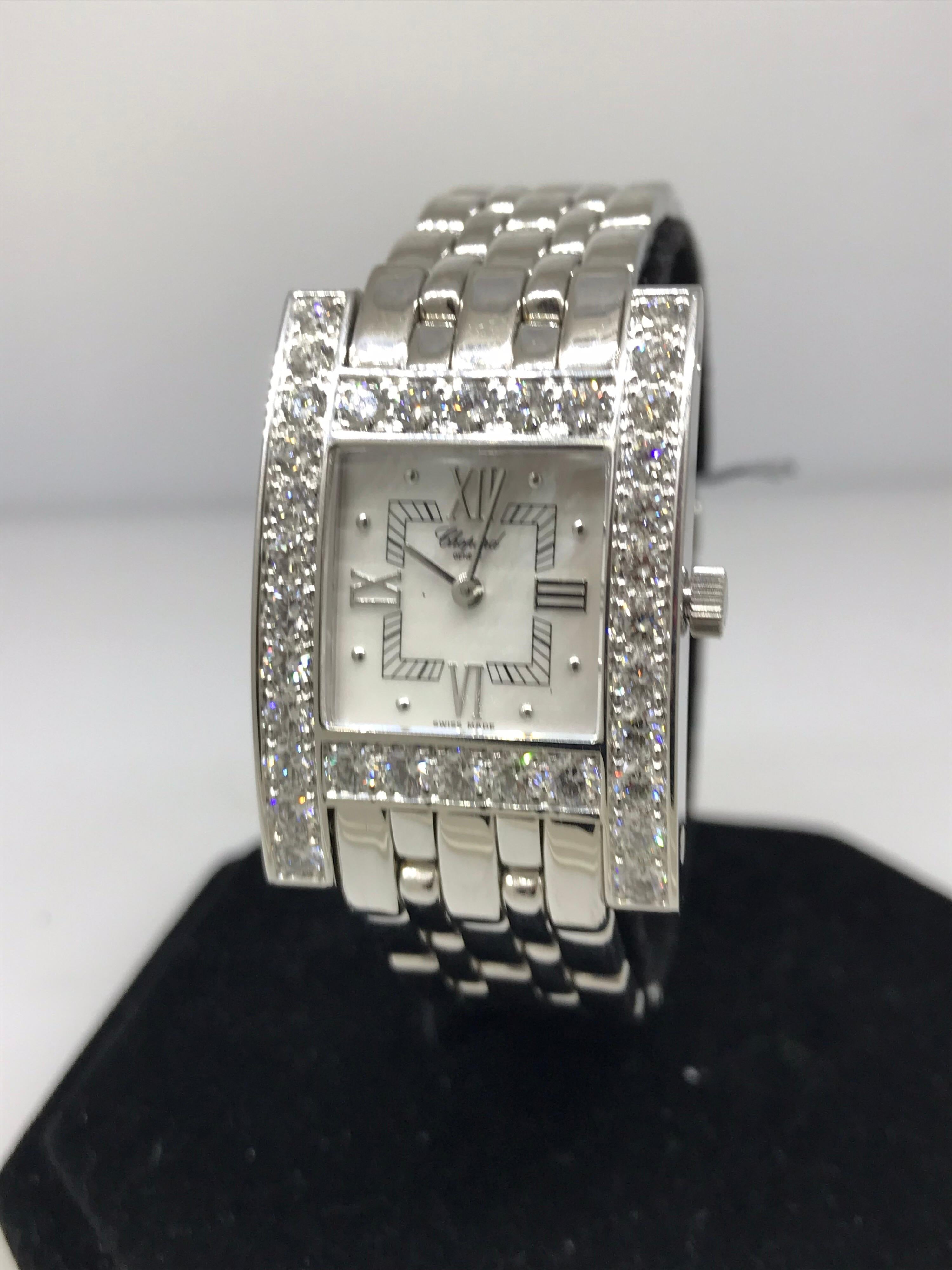 Chopard H Ladies Watch

Model Number: 10/6805-1001

100% Authentic

New / Old Stock

Comes with original Chopard Box, Certificate of Authenticity and Warranty, and Instruction Manual

18 Karat White Gold Case & Bracelet

Diamond Bezel & Lugs

Mother