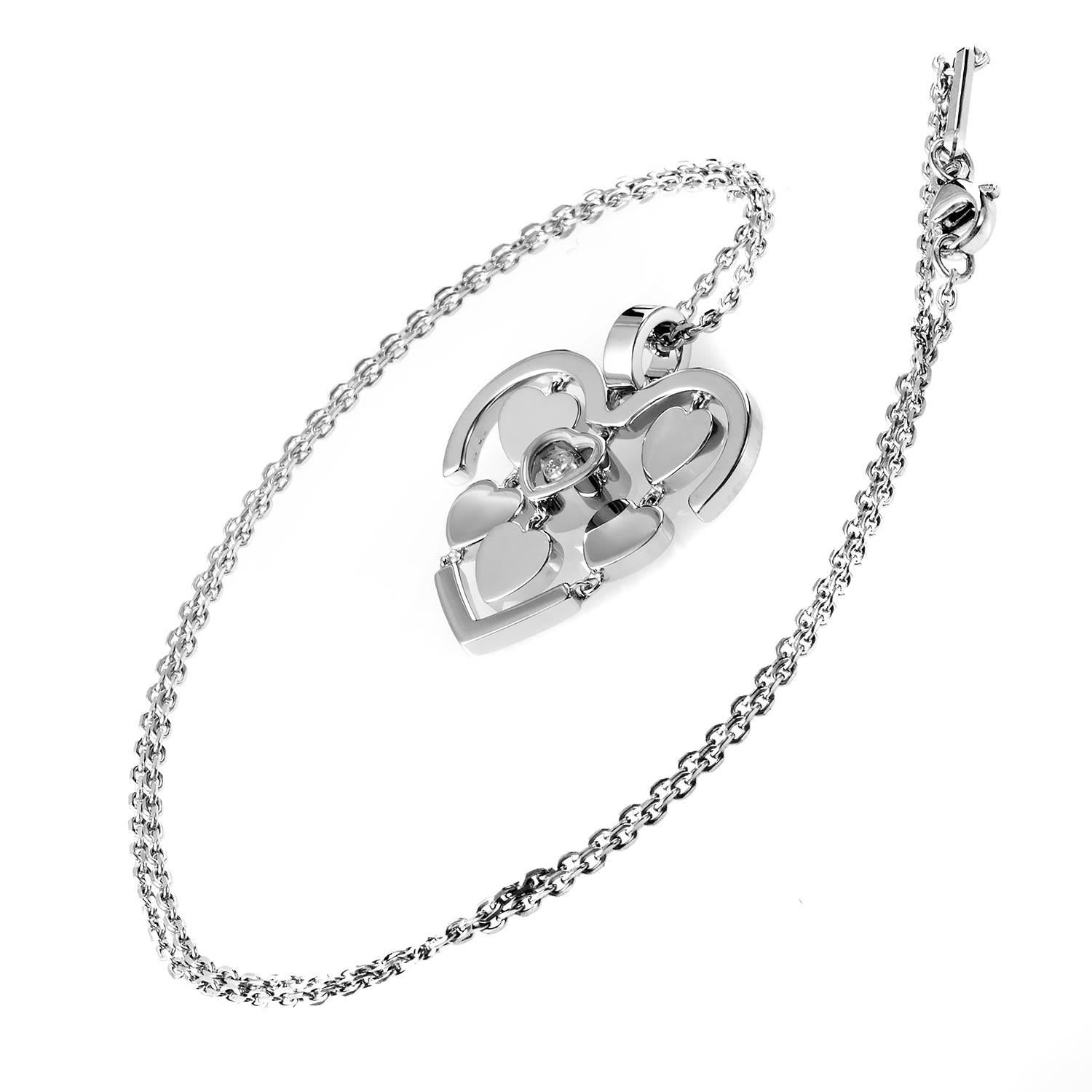 This dazzling pendant necklace from Chopard's Happy Amore collection is the perfect gift for a loved one. The necklace is made of 18K white gold and features a heart shaped pendant accented with smaller dangling hearts. Lastly, a single floating