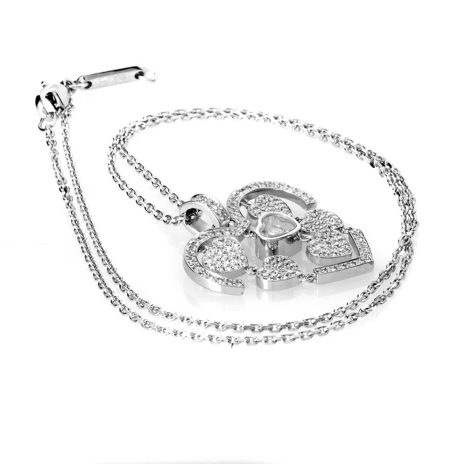 Sassy yet classy, this Chopard Happy Amore pendant necklace is sure to turn heads! The necklace is made of 18K white gold and features a heart shaped pendant accented with smaller dangling hearts paved with diamonds. Lastly, a single floating