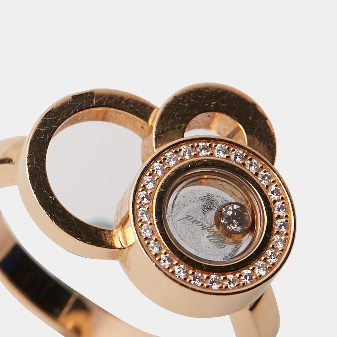 Made from 18k rose gold, this ring is from the Chopard Happy Bubbles collection. It is styled with little circles to resemble bubbles and finished with an encased diamond that moves with you. Add a dazzling finish with this splendid piece from