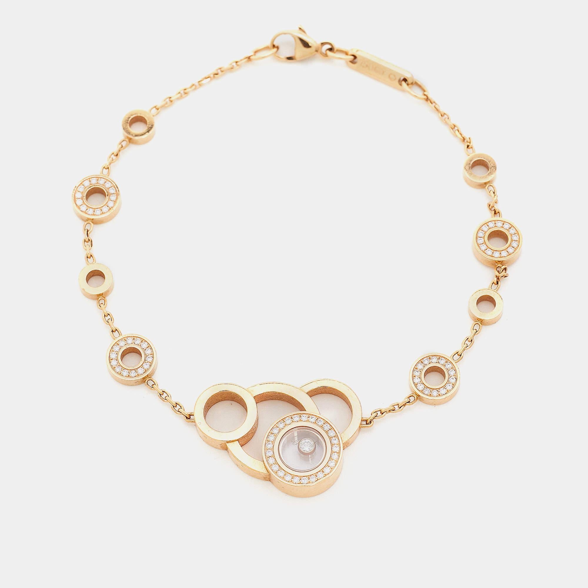 This Chopard bracelet is from the brand's Happy Diamonds Bubbles collection and it is made from 18k rose gold. It has little rings to resemble bubbles and one of them has a floating diamond. It'll be an elegant complement to your wrist.

