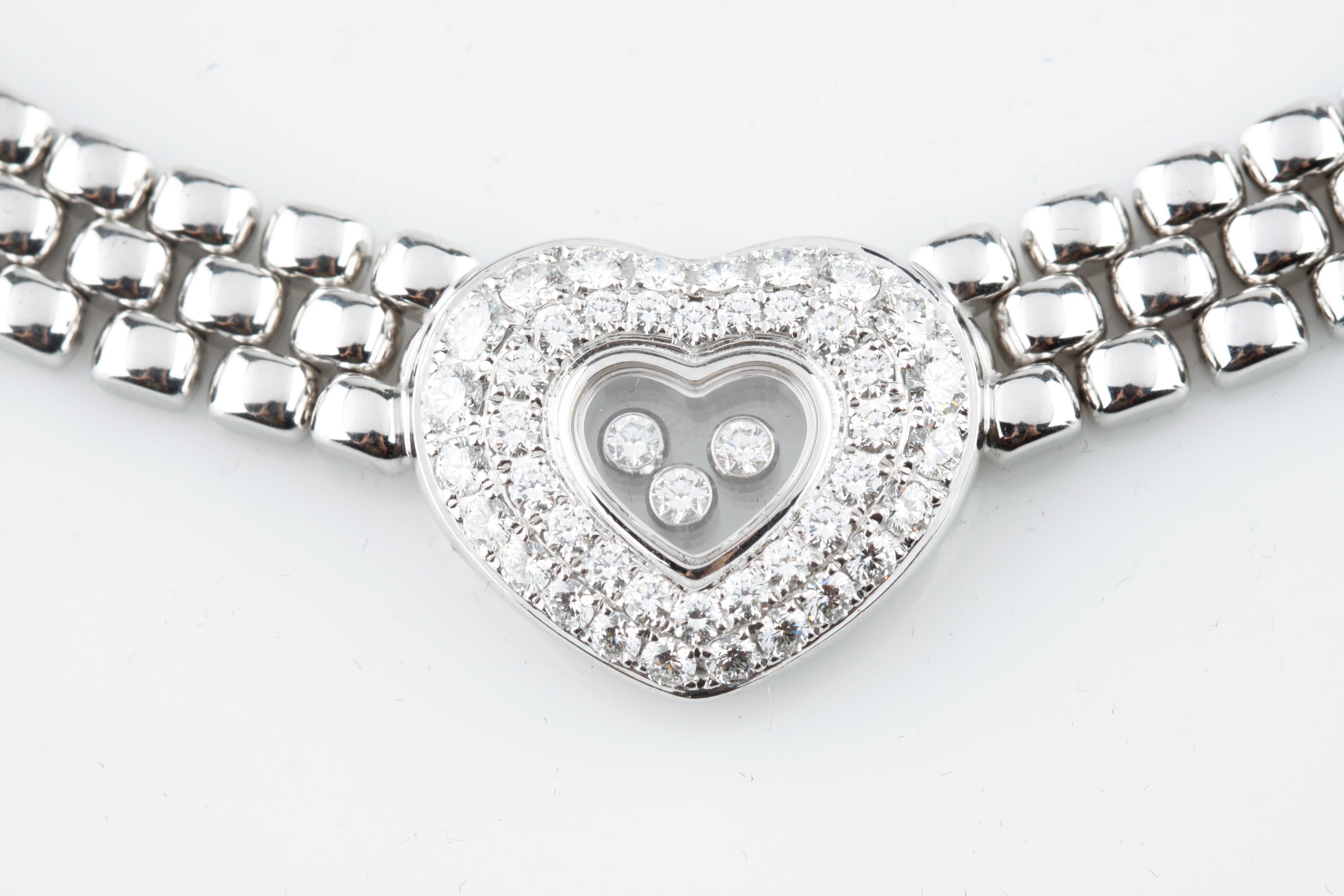 Gorgeous Chopard Happy Diamond series choker done in solid 18K White Gold 
Triple row necklace design showcasing a diamond incrusted Heart Pendant
45 total Diamonds Bezel-set surrounding the heart-shaped Pendant 
3 loose 
