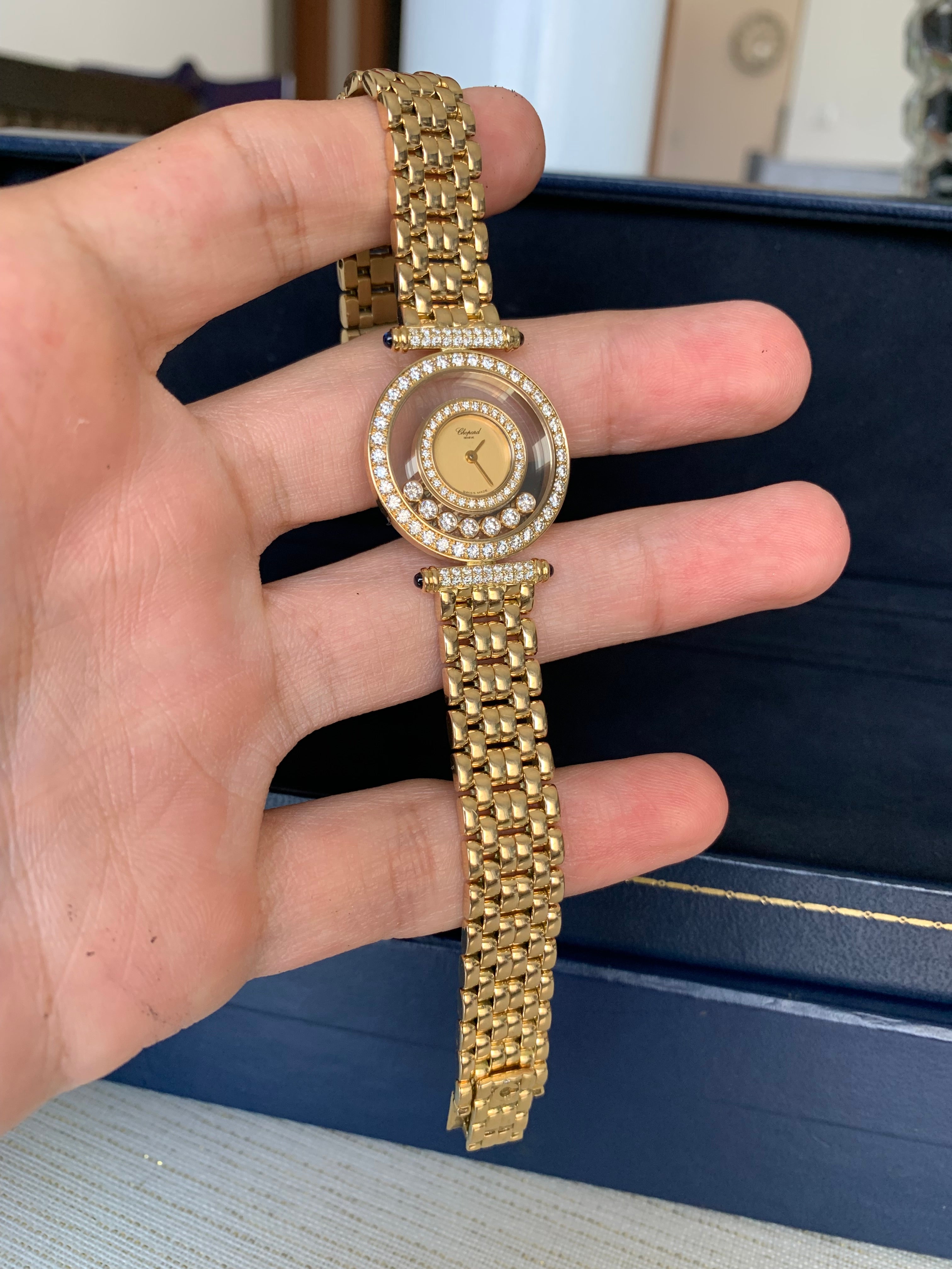 Chopard Happy Diamonds, Swiss Made, In Solid 18k Yellow Gold, Both Case & Bracelet.
Amazing Shine, Incredible Craftsmanship.
Great Statement Piece.
Factory Set Diamonds On The Case, Bezel & Lugs.
Set With Cabochon Blue Sapphires As Well.
Real Work