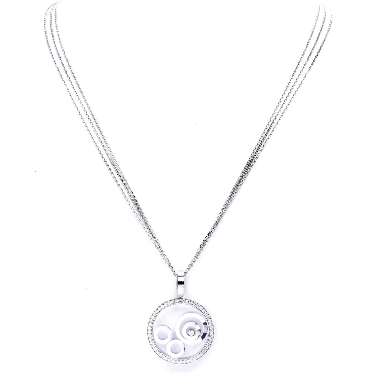 This stunning, high polished, white gold 18k circular Pendant necklace by Chopard.

The design is from the 