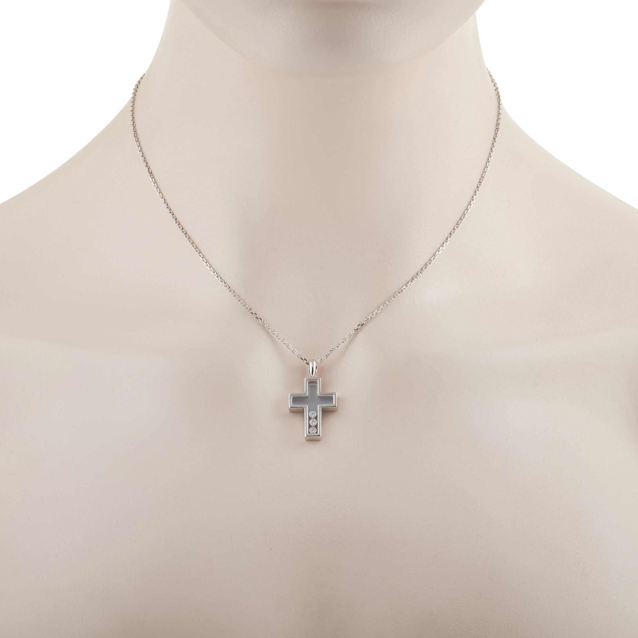 This pendant necklace from Chopard is a creative take on a symbolic piece of jewelry. Suspended from a 16” chain with lobster clasp closure is a transparent 18K White Gold cross-shaped pendant, which includes a trio of diamonds captured within. The