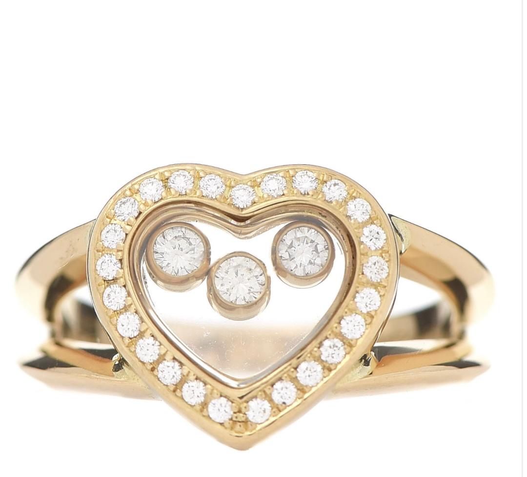 Chopard Happy Diamond 18K Yellow Gold Floating Diamond Heart Ring
Estimated Retail Price: $4,570
Authenticity, 82/4582 Serial # 9383248
The ring is a size 4.5 and is stamped along the inner shank Chopard 750 indicating the authenticity and metal