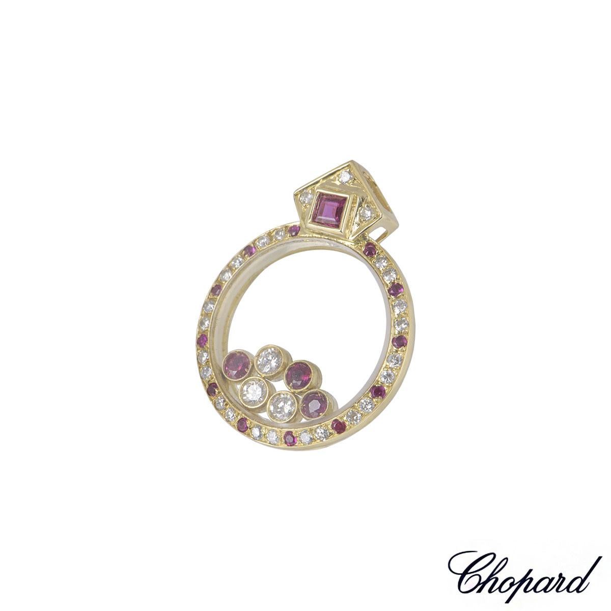 A classic 18k rose gold Chopard diamond pendant from the Happy Diamonds collection. The pendant is pave set with 22 round brilliant cut diamonds totalling approximately 0.15ct, alternating with 12 rubies totalling approximately 0.08ct surrounding