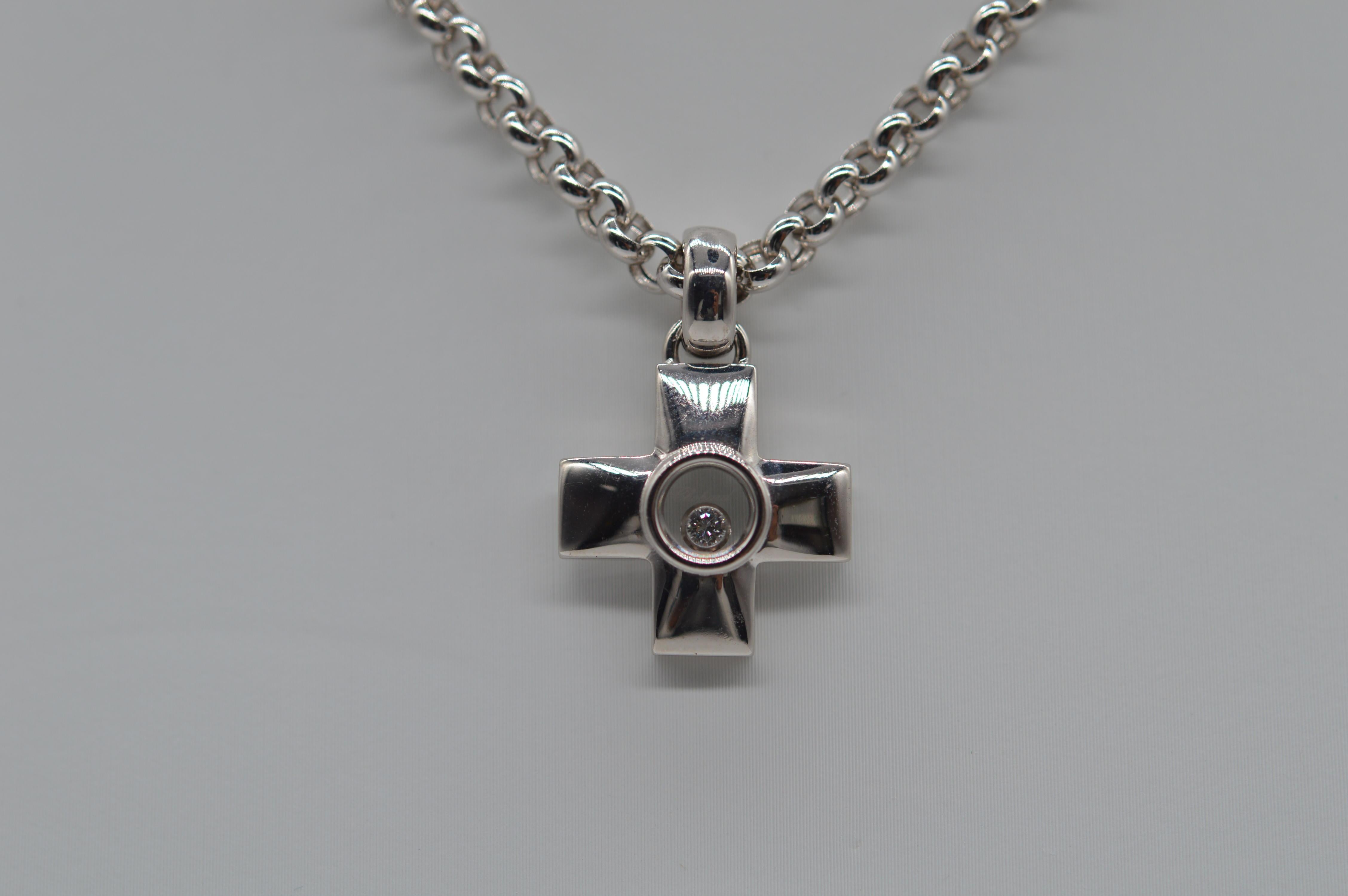 Chopard Happy Diamond Cross Pendant Unworn
18K White Gold
Weight 26.6 grams 
Diamond Setting 
Set with 1 Round Diamond for a total weight of 0.05 carats
Vintage unworn
With original box & certificate from Chopard