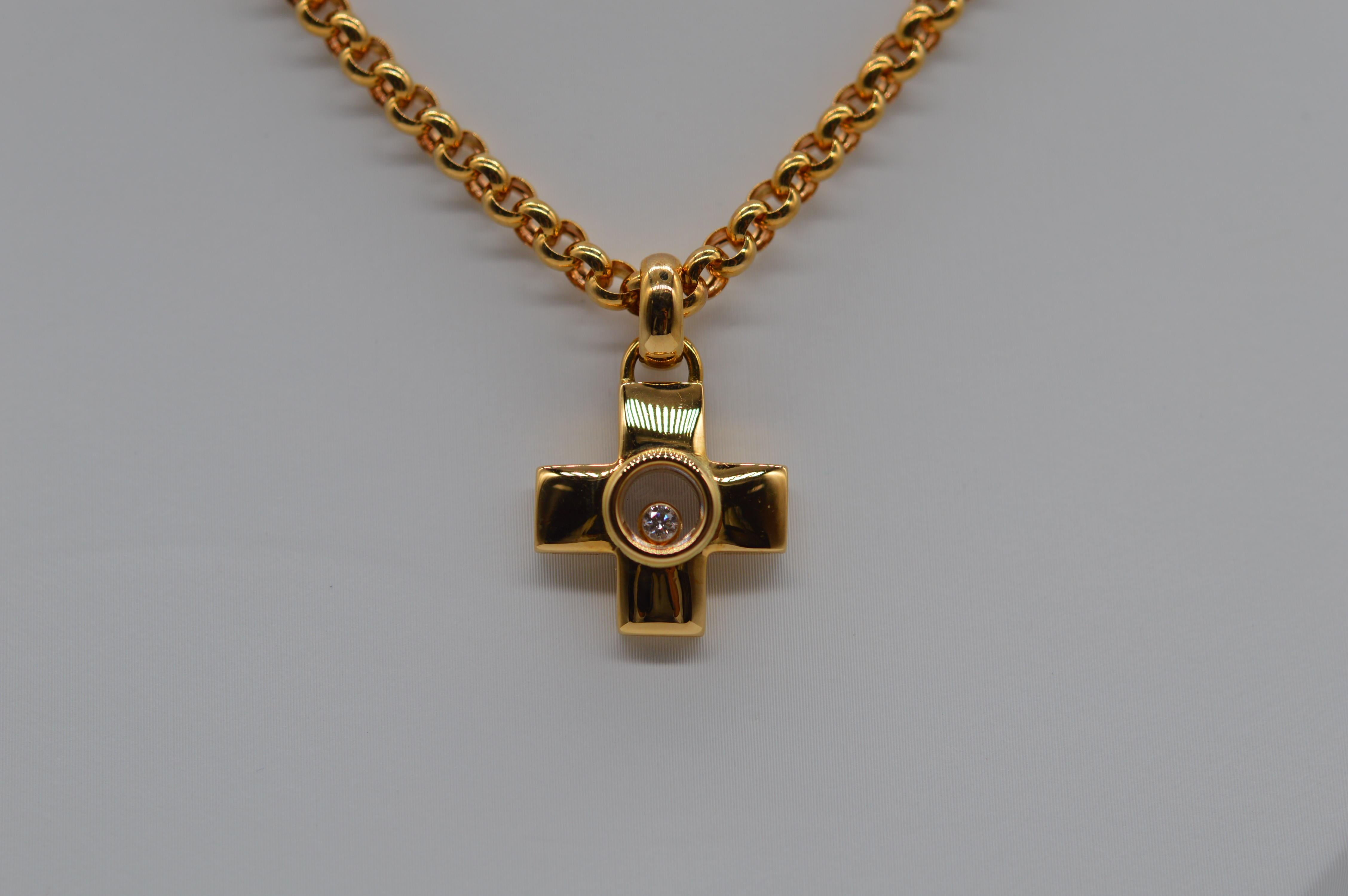 Chopard Happy Diamond Cross Pendant Unworn
18K Yellow Gold 
Weight 24.4 grams
Diamond Setting
Set with 1 Round Diamond for a total weight of 0.05 carats
Vintage unworn
With original box & certificate from Chopard
