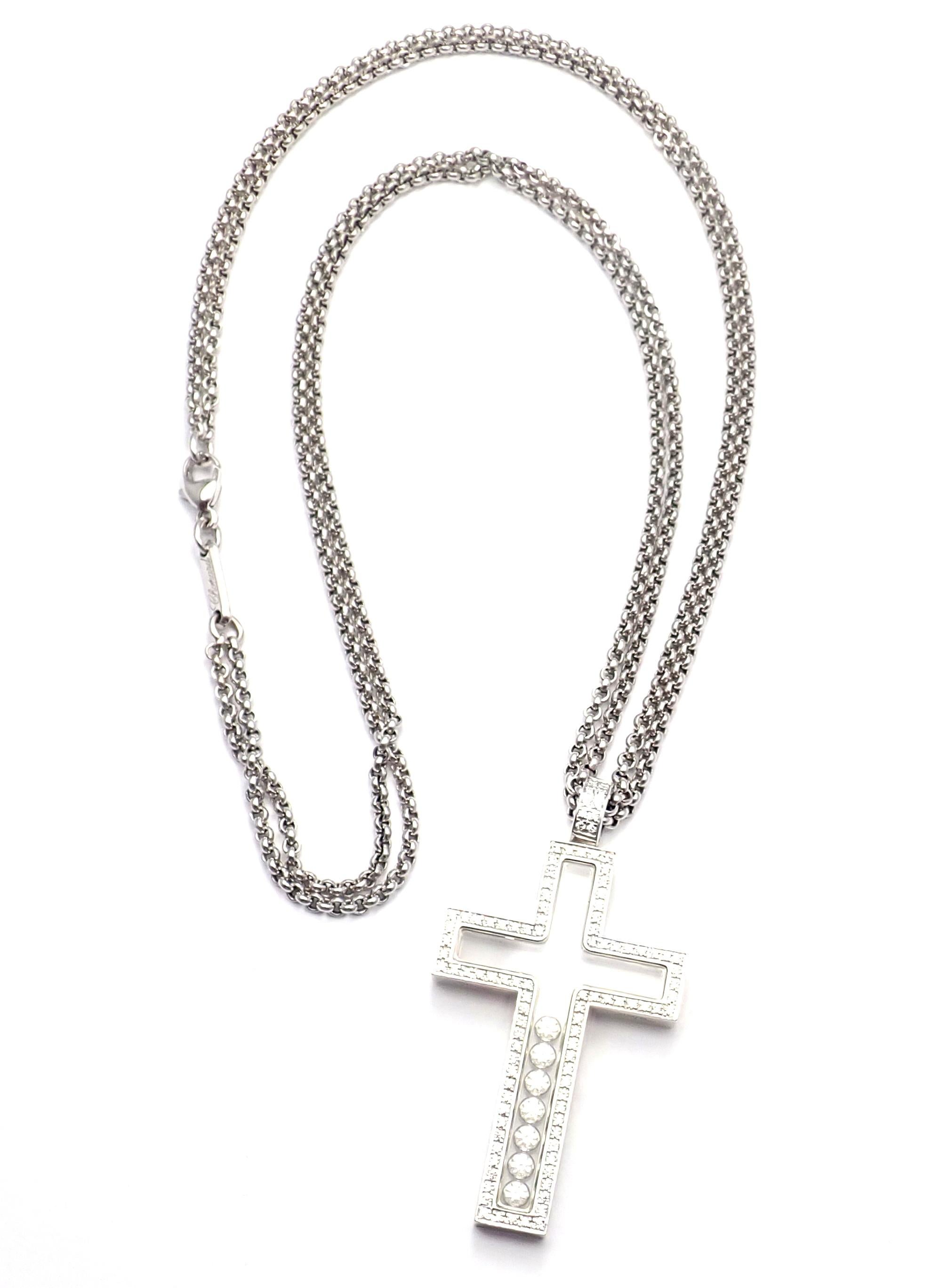 18k White Gold Diamond Happy Diamonds Cross Pendant Necklace by Chopard.  
With Round Brilliant Diamonds = VVS1 clarity, E color total weight 1ct
Details:  
Length: 17