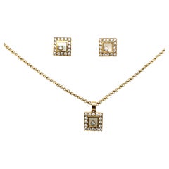 Chopard Happy Diamond Ohrringe und Anhänger aus 18 Karat Gelbgold mit Diamanten