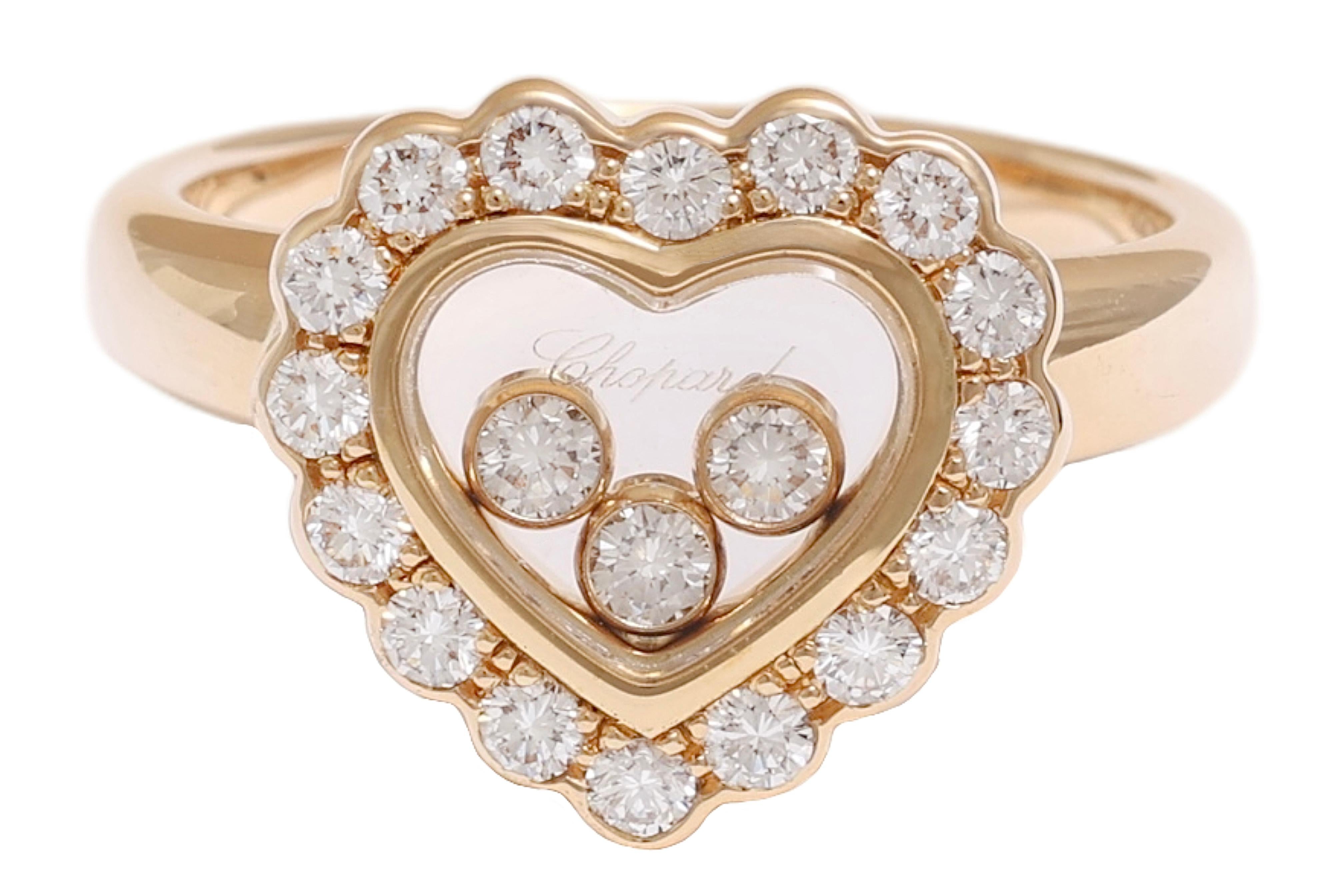 18ct gold & diamond 'Happy Diamonds' ring, Chopard centring a heart-shaped glazed compartment framed by brilliant-cut diamonds enclosing three floating collets accented with brilliant-cut diamonds

Material : 18kt yellow gold

Size : US 7 / EU 54 (