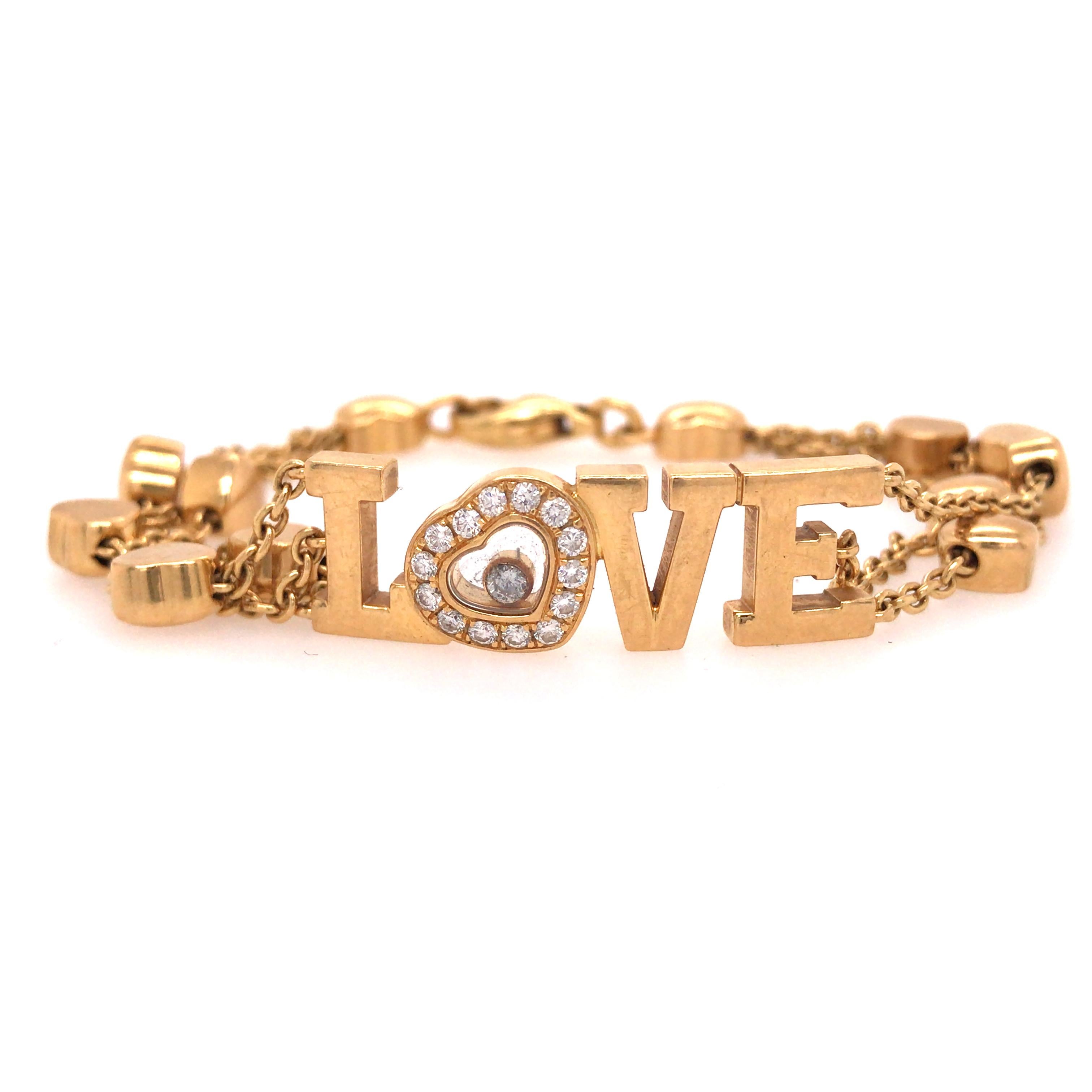 Chopard Happy Diamond Love Bracelet in 18K Yellow Gold.  Round Brilliant Cut Diamonds weighing 0.33 carat total weight, E-F in color and VVS in clarity are expertly set.  The Bracelet measures 6 1/2 inch in length and 3/8 inch in width. 25.97 grams.