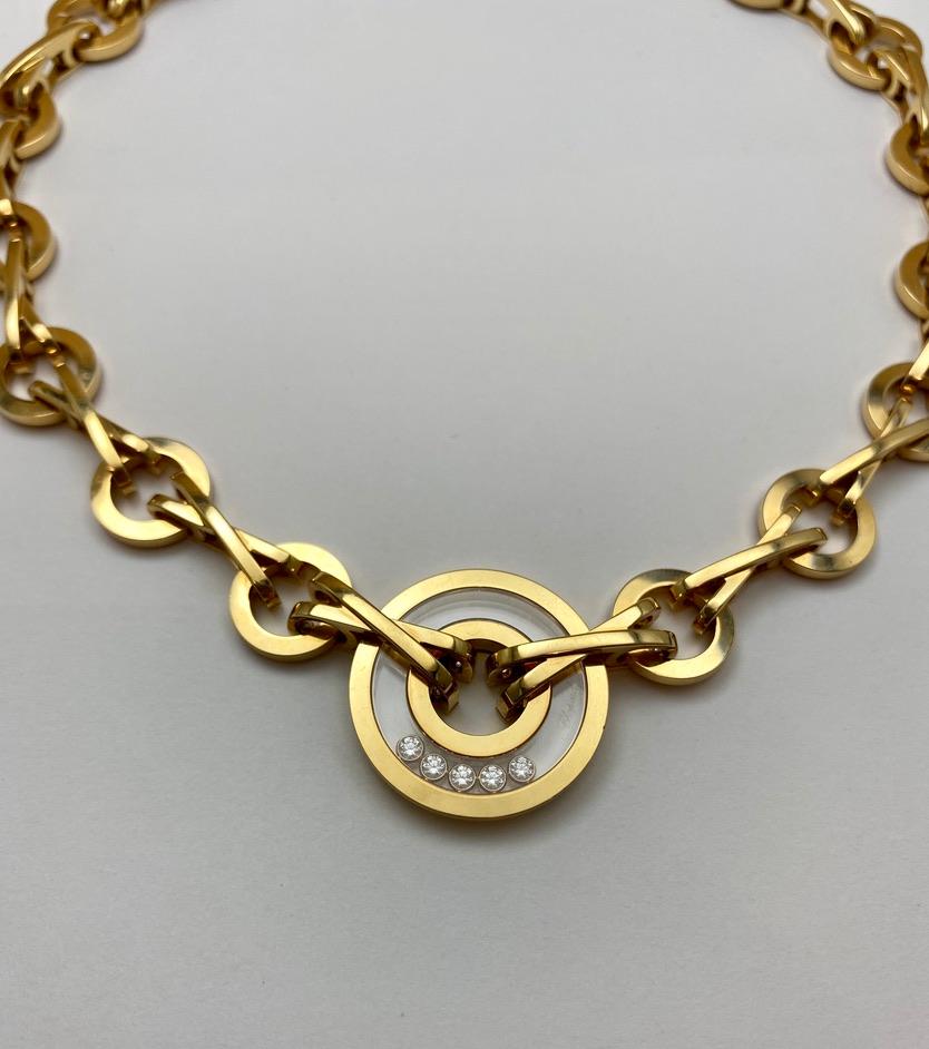 An iconic design from the famous jeweler Chopard, the Happy Diamonds Collection features freely moving diamonds encased in gold and transparent sapphire.  This stylish choker was originally purchased in Saint Tropez and it must have certainly