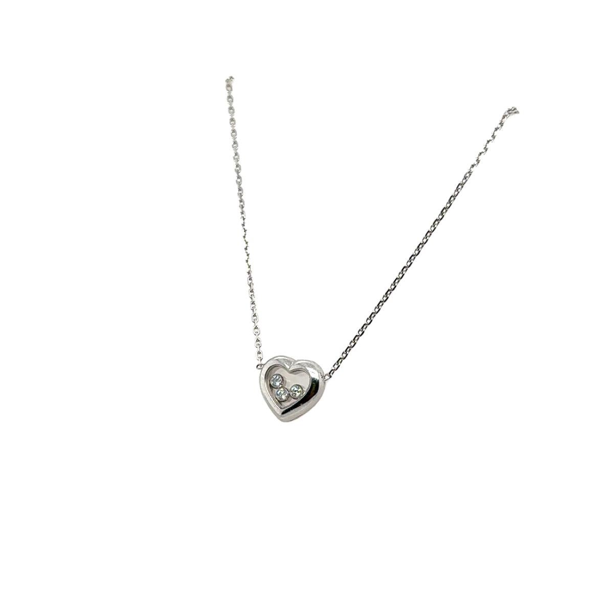 Timeless design by famed designer Chopard. From the happy diamond collection this necklace is crafted in 18k white gold. The necklace highlights one heart shaped pendant that contains Chopard's iconic floating diamond design.
Three bezel set