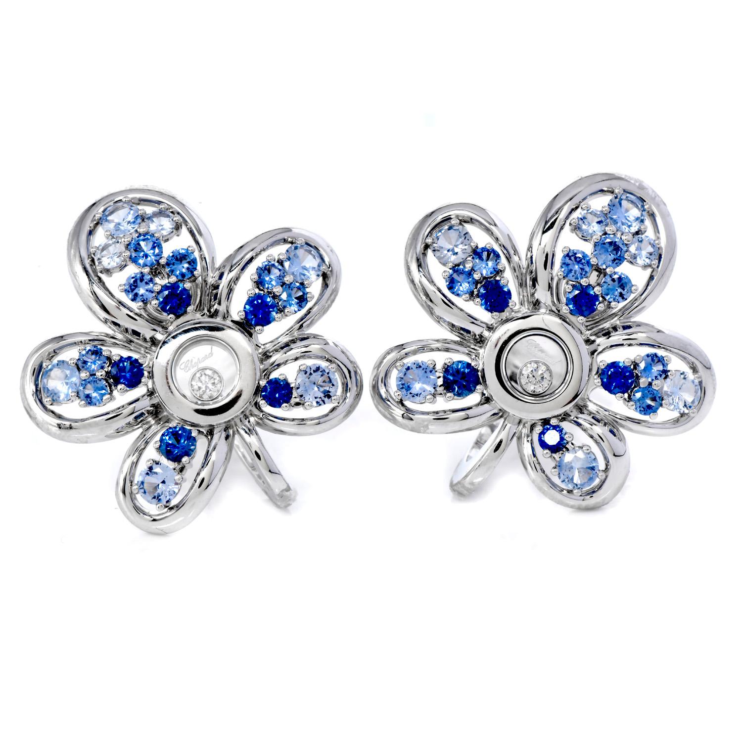 The pendant & earrings are finely crafted from luxurious 18K white gold.

This set features Light blue to Deep Blue Color Genuine Sapphires, round-cut, prong-set, weighing 5.40 carats,

The (3) Round cut, Bezel Set, Floating Diamonds weight approx.