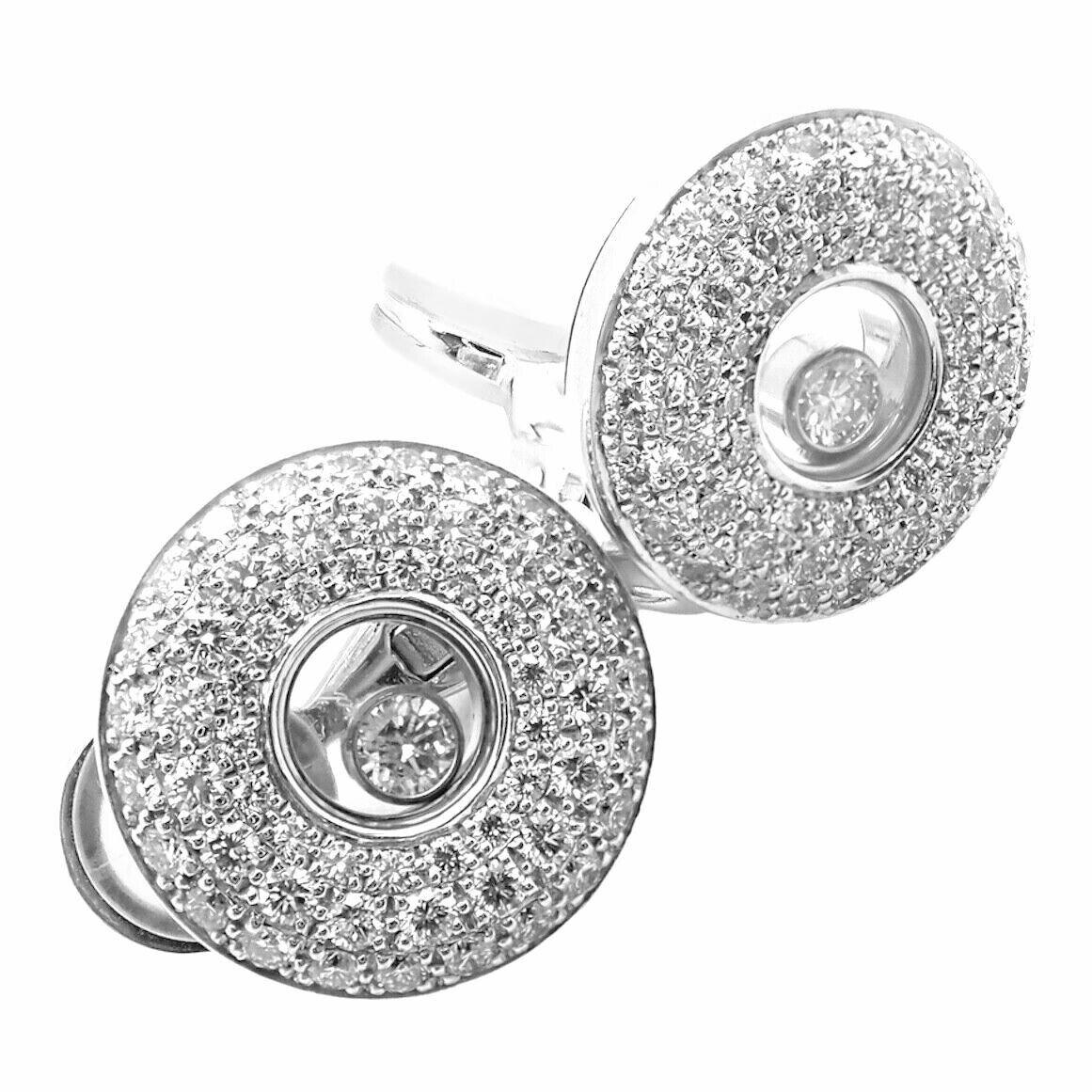 18k White Gold Happy Diamond Earrings by Chopard.  
With 124 round brilliant cut diamonds VVS1 clarity, E color and 2 round brilliant cut floating diamond total weight approx. 1.50ct
These earrings are for pierced ears.
Details:  
Measurements:
