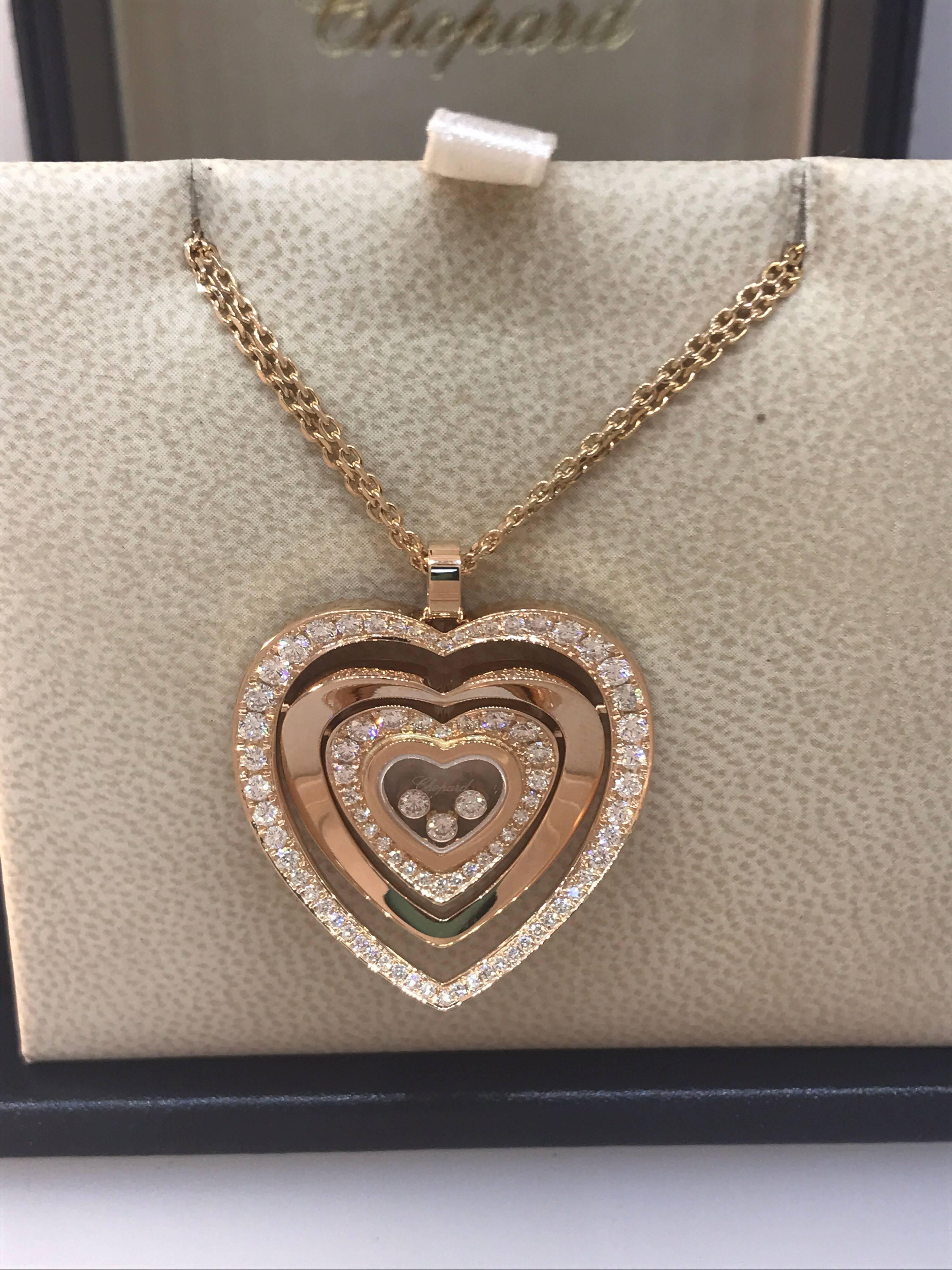 Chopard Happy Diamonds Heart Pendant / Necklace

Model Number: 79/7221-5002

100% Authentic

Brand New

Comes with original Chopard box, certificate of authenticity and warranty, and jewels manual

18 Karat Rose Gold (20.8gr)

80 Diamonds on the
