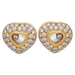 Orecchini a cuore con diamanti in oro giallo Chopard Happy Diamonds 18 kt.