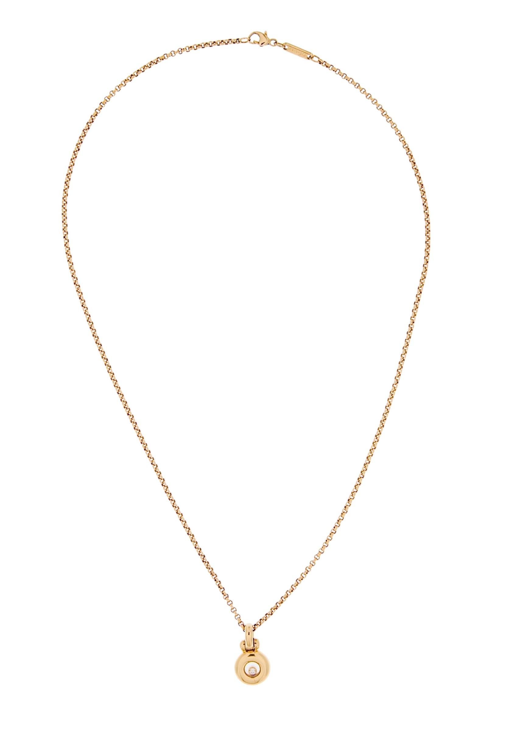 An iconic piece from Chopard’s celebrated *Happy Diamonds* collection, this stunning necklace captures the essence of joyful movement and refined luxury. Expertly crafted in rich 18-karat yellow gold, it features a delicate chain and a signature