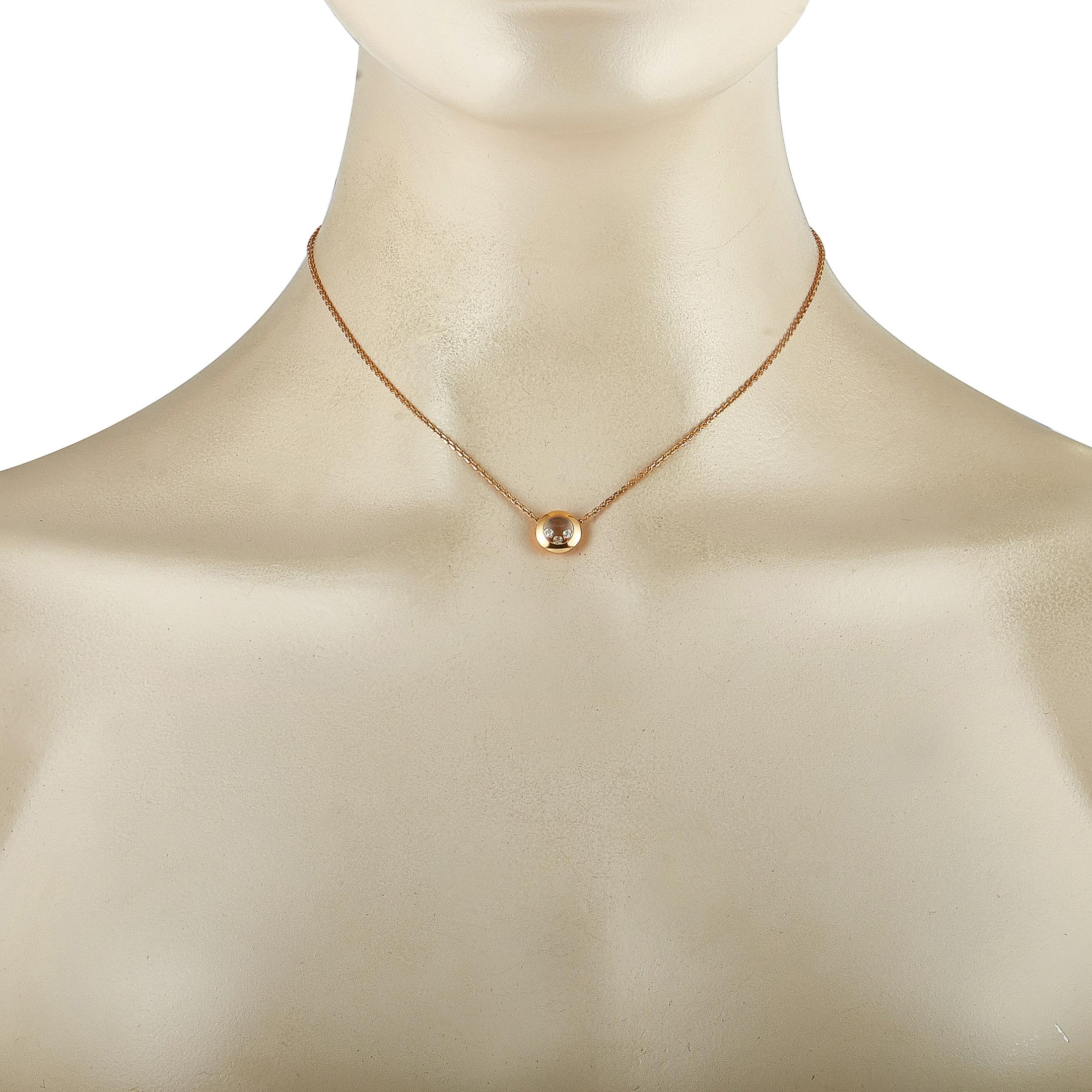 The Chopard “Happy Diamonds” necklace is made of 18K rose gold and embellished with floating diamond stones that amount to 0.08 carats. The necklace weighs 5.4 grams and is presented with a 14” chain, onto which a 0.37” by 0.37” pendant is