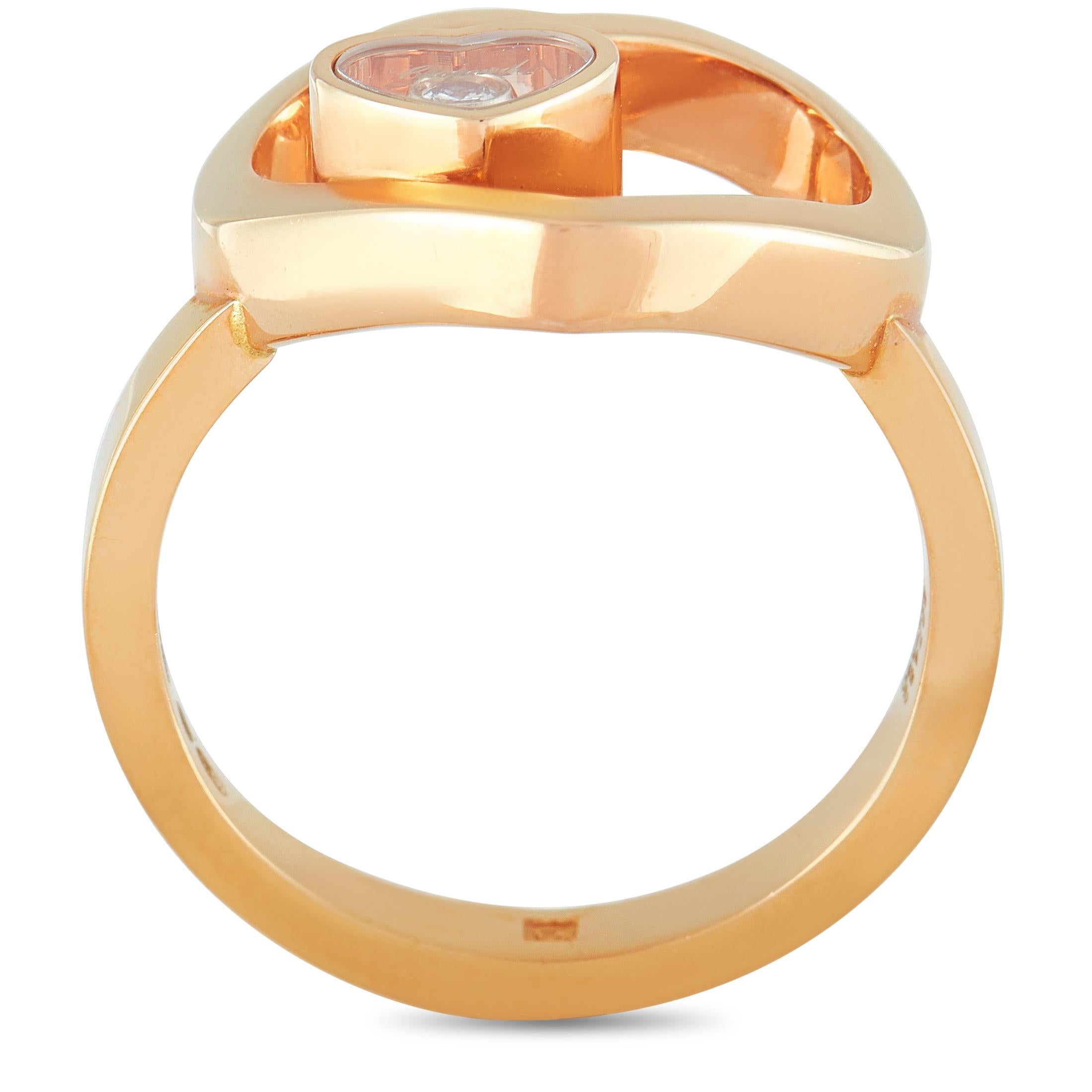 The Chopard “Happy Diamonds” ring is made of 18K rose gold and features a floating diamond stone that weighs 0.05 carats. The ring weighs 5.5 grams and boasts band thickness of 2 mm and top height of 7 mm, while top dimensions measure 16 by 13 mm.
