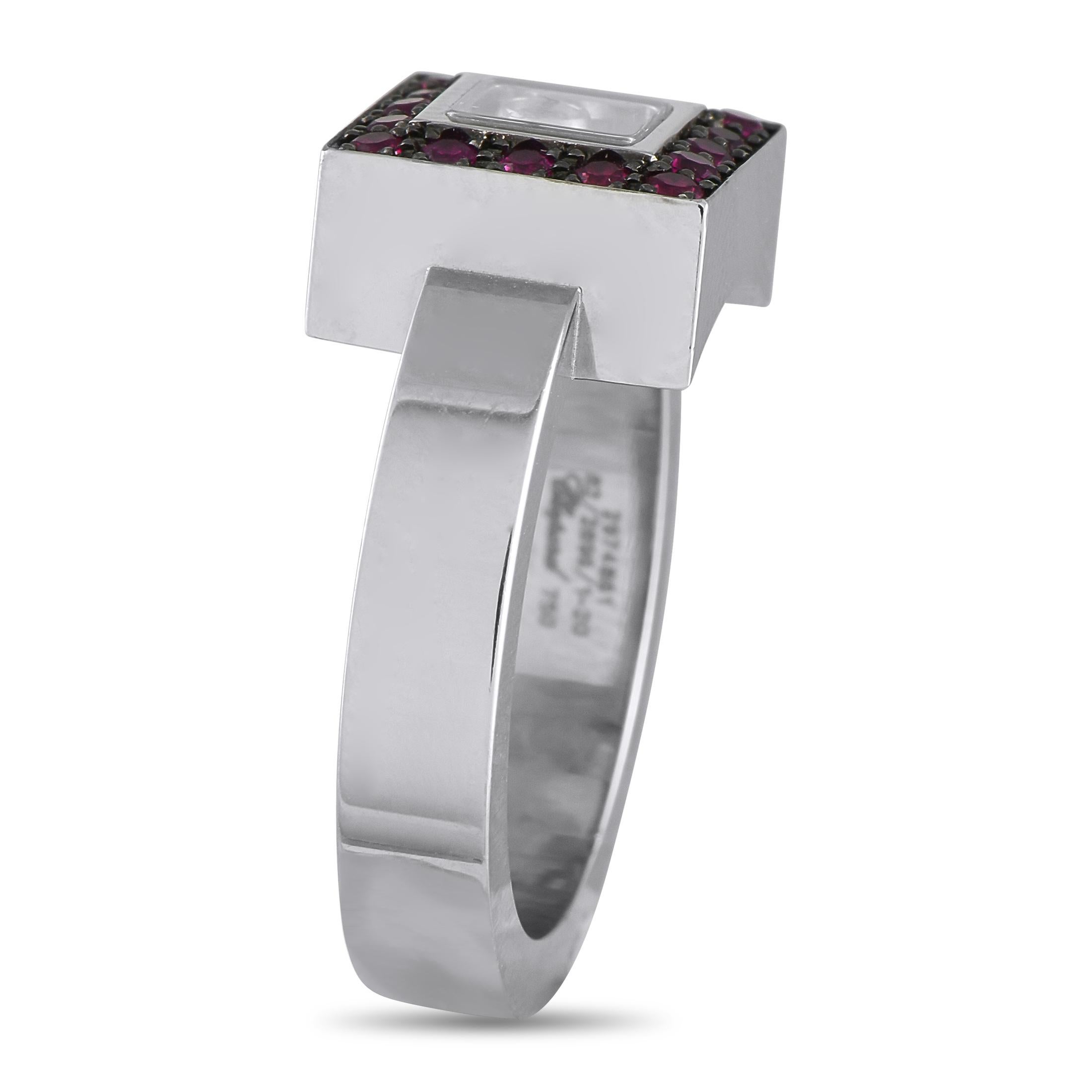 A sleek geometric design sets the stage for this charming Chopard Happy ring. In the transparent center, a singular 0.05 carat bezel-set Diamond adds the perfect amount of movement. The unique center stone is surrounded by inset Ruby gemstones in a